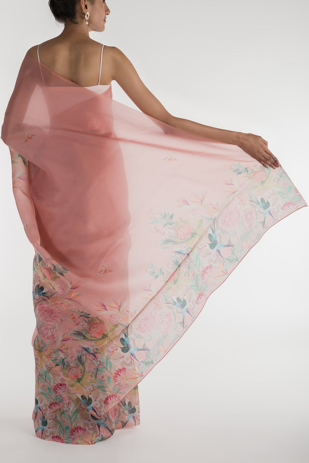Pleats and pallu of Peach Satin Organza Saree with Bird Print on the body and Without Border