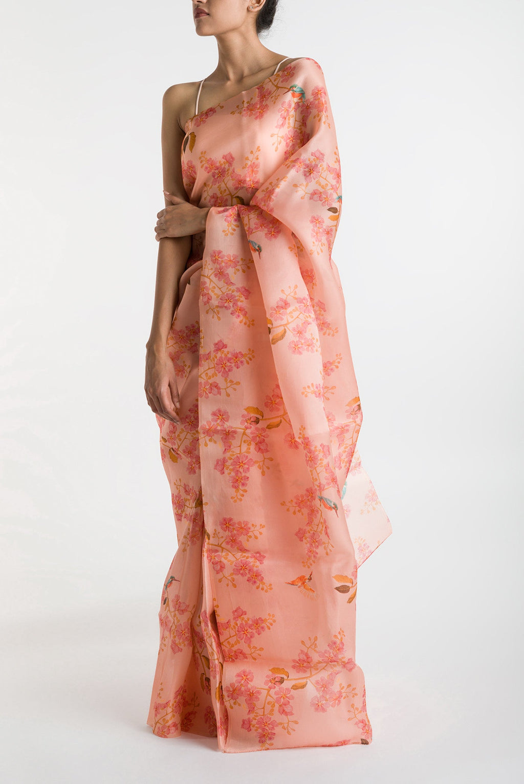 Peach Satin Organza Saree with Bird Print on the body and Without Border displayed on a mannequin