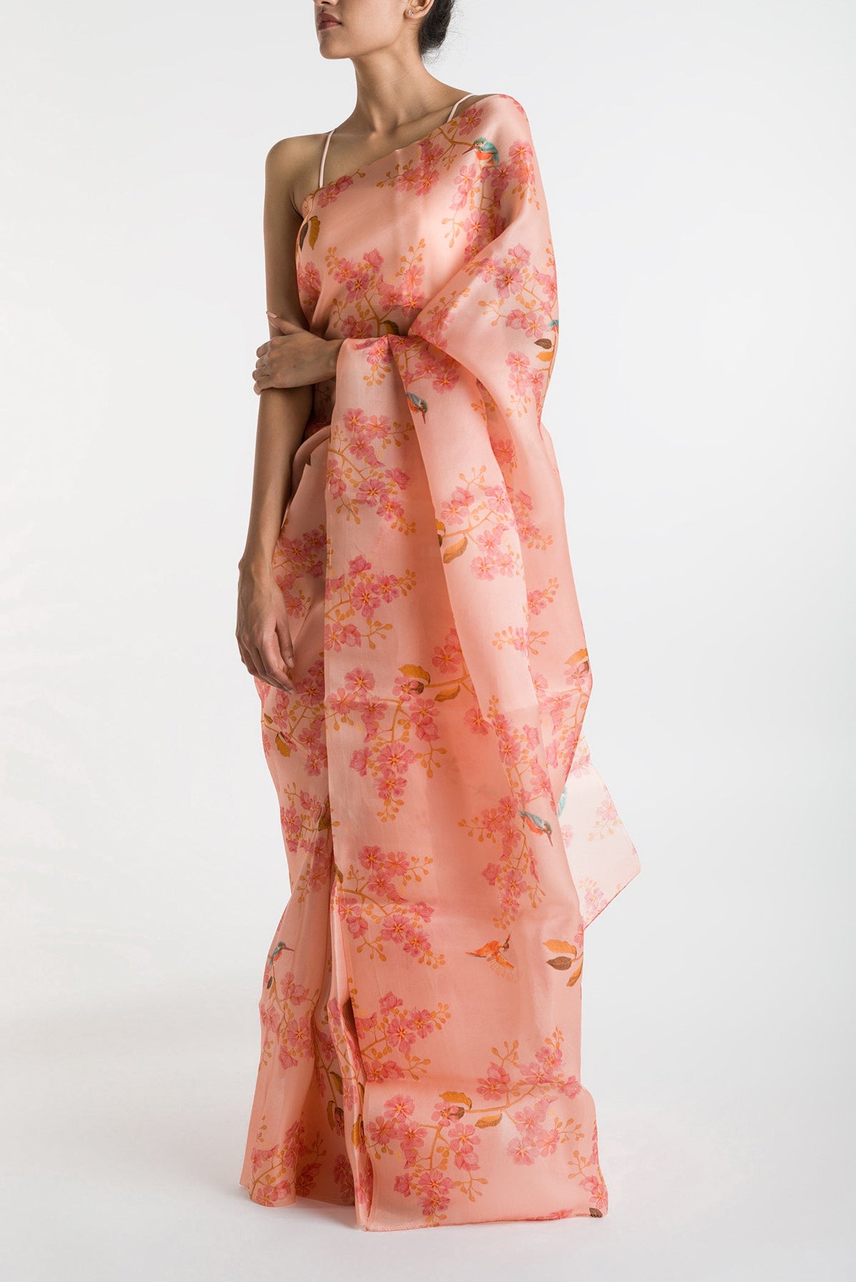 Peach Satin Organza Saree with Bird Print on the body and Without Border displayed on a mannequin