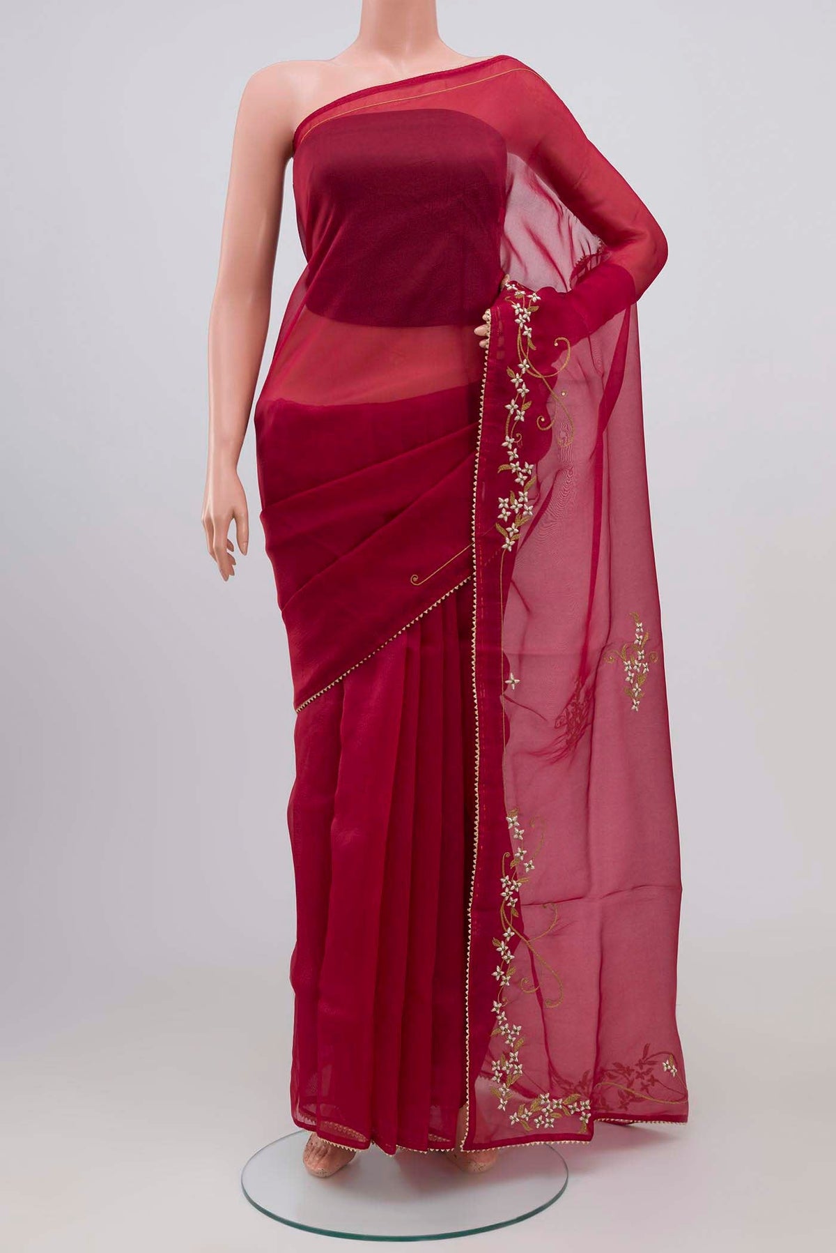 Maroon Organza Silk Saree with Plain Body and Embroidery Border displayed on a mannequin