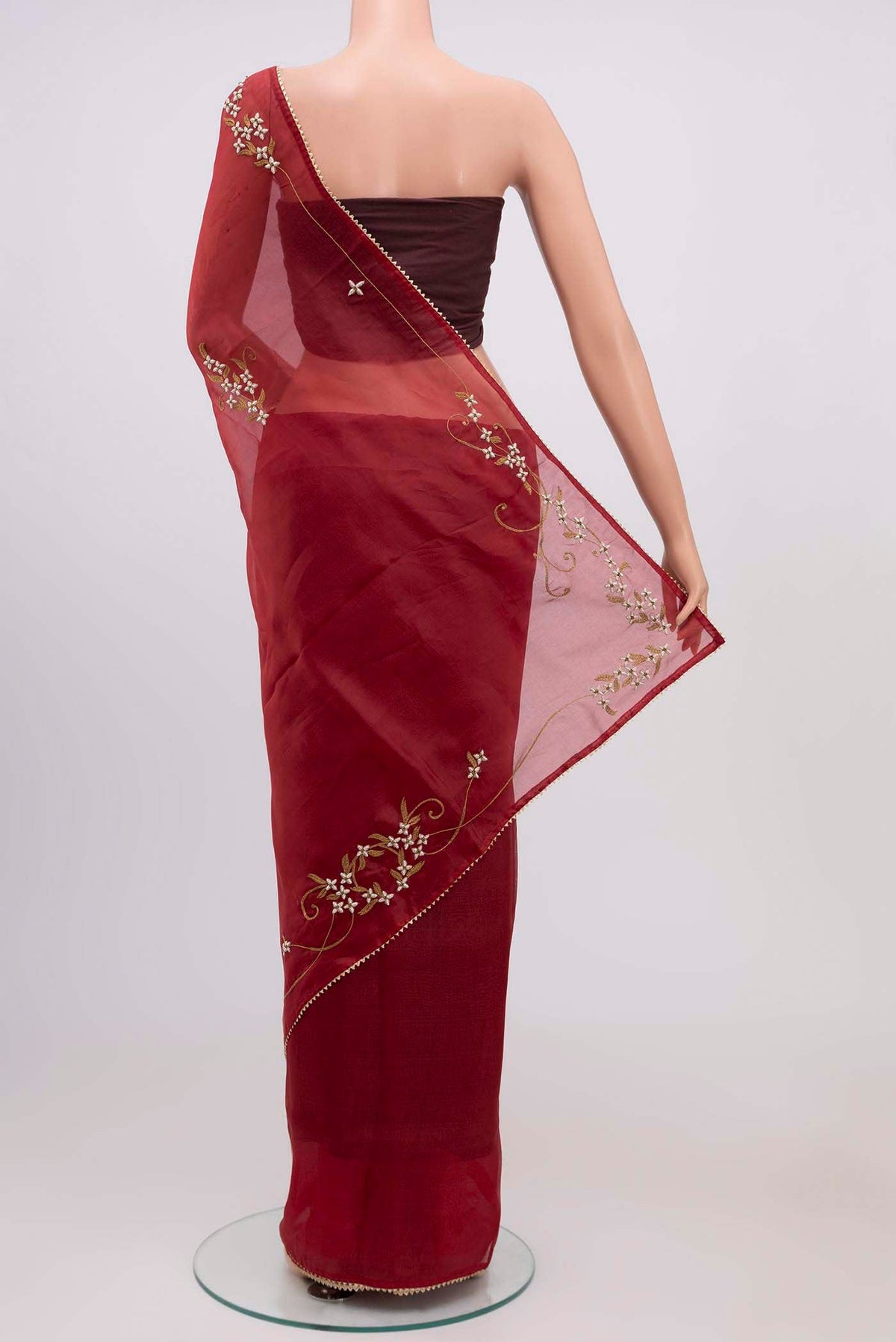 Pleats and pallu of Maroon Organza Silk Saree with Plain Body and Embroidery Border