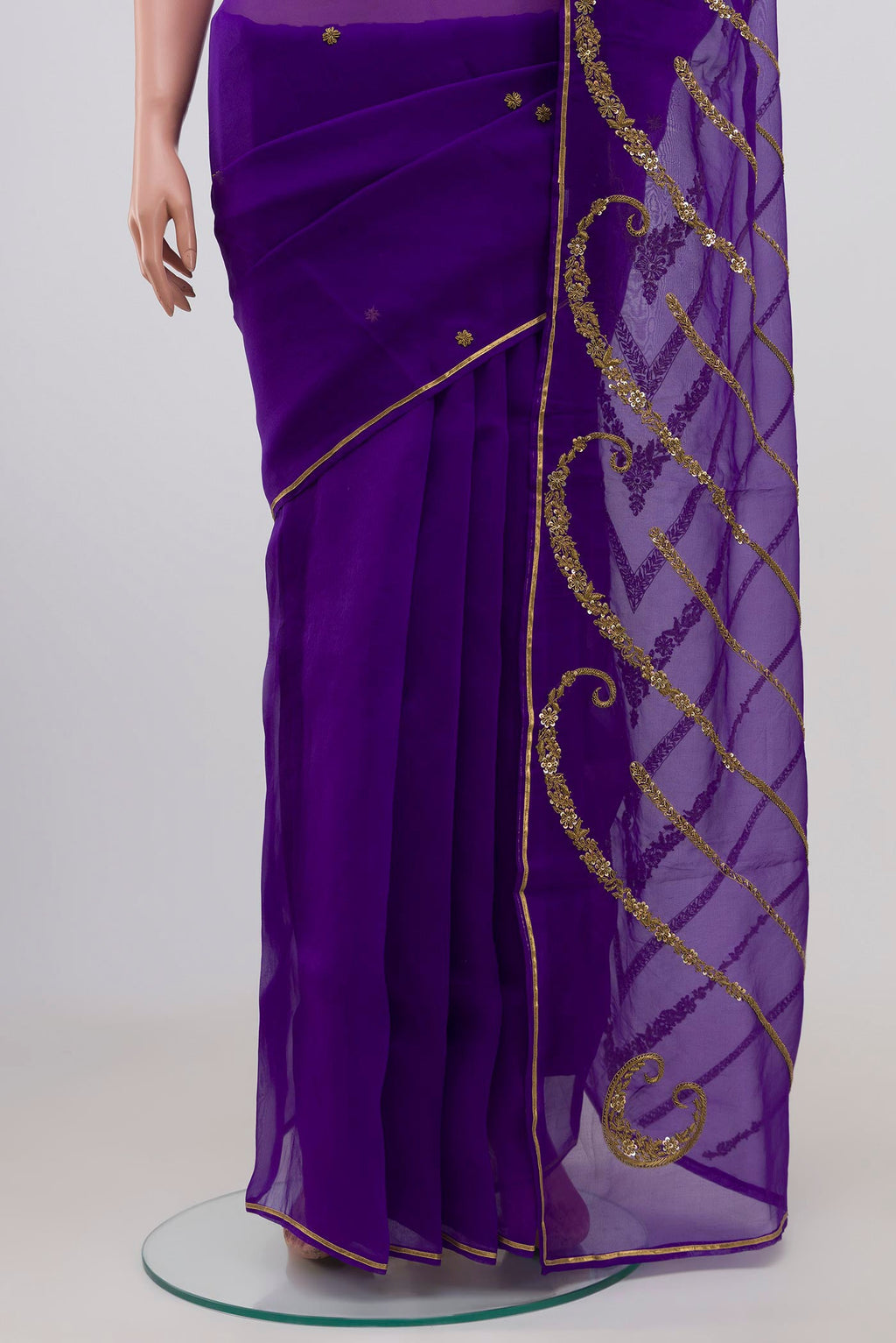 Pleats and pallu of Violet Organza Silk Saree with Embroidery on the body and Embroidery Border