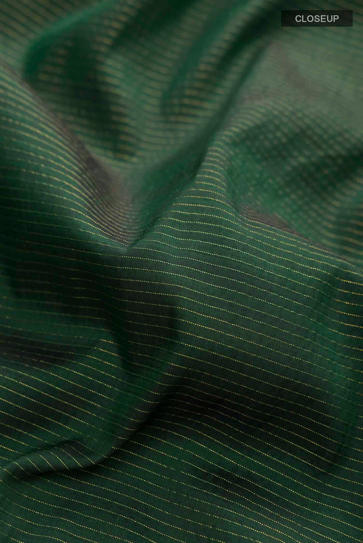 Close up of Pure Silk Pure Zari Green Kanchipuram Nine Yards Saree with Stripes on the body and Zari Border displaying folds