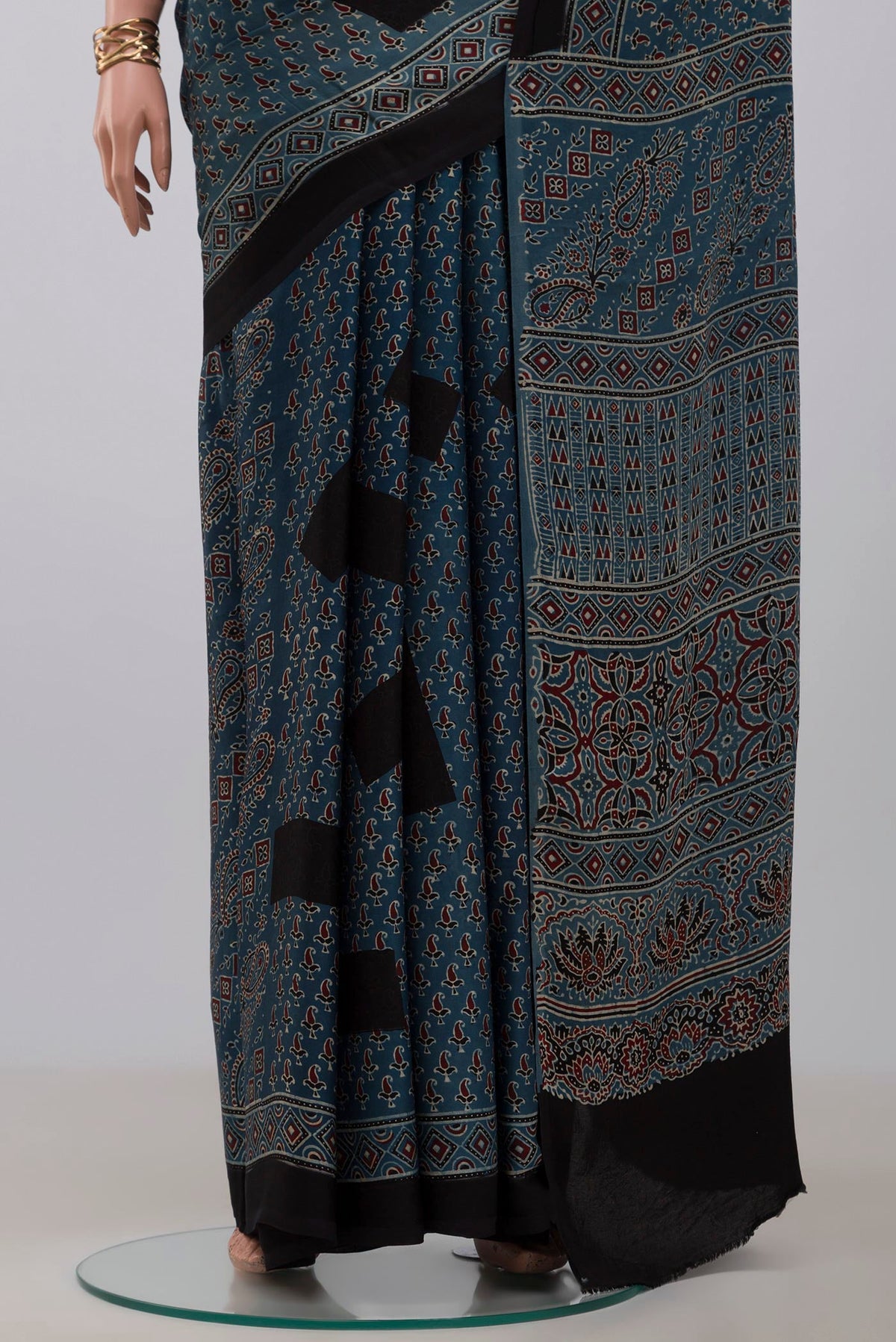 Pleats and pallu of Blue Blended Satin Silk Saree with Ajrakh Print on the body and Printed Border. 
