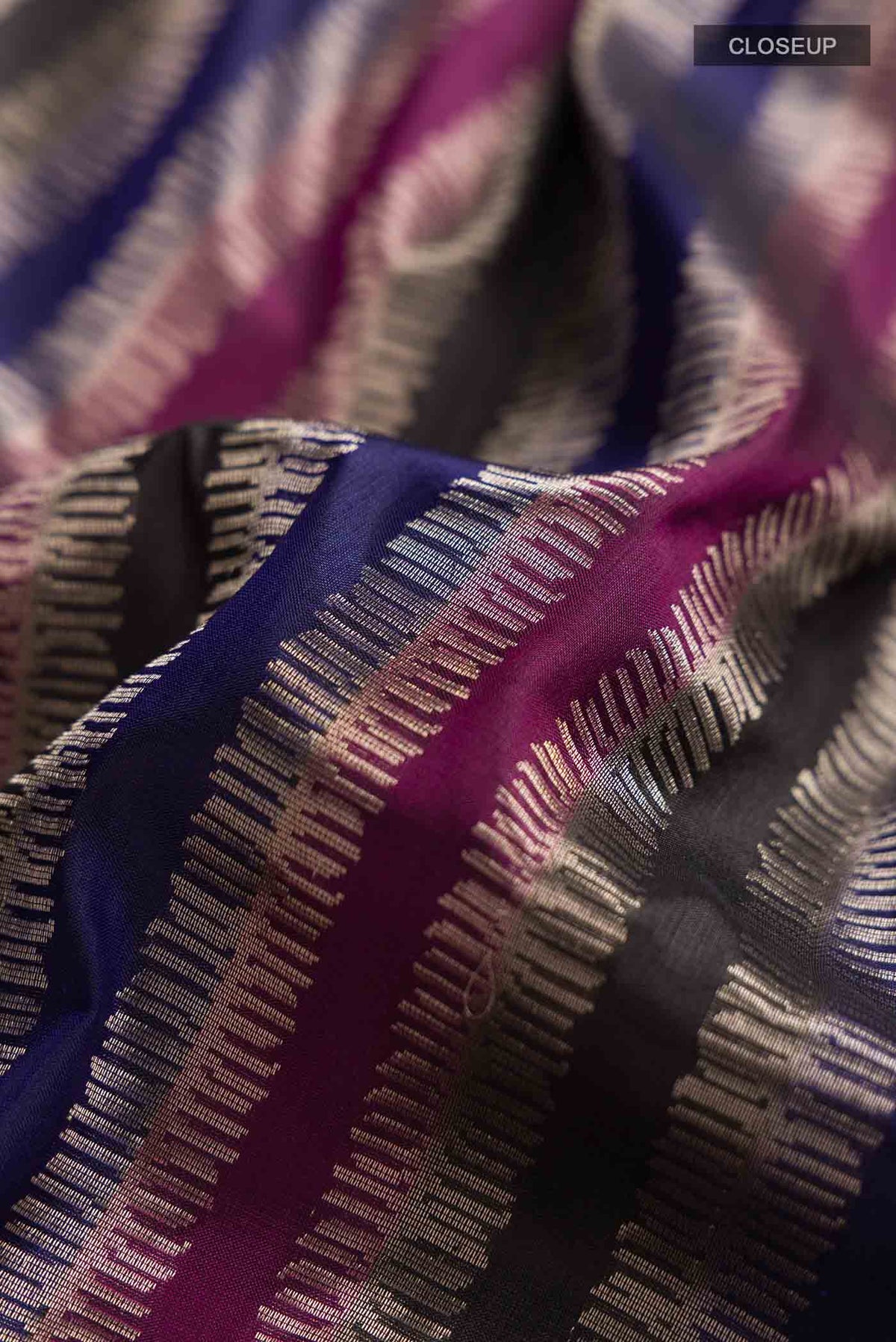 Close up of Multi Banarasi Silk Saree with Stripes on the body and Zari Border displaying folds