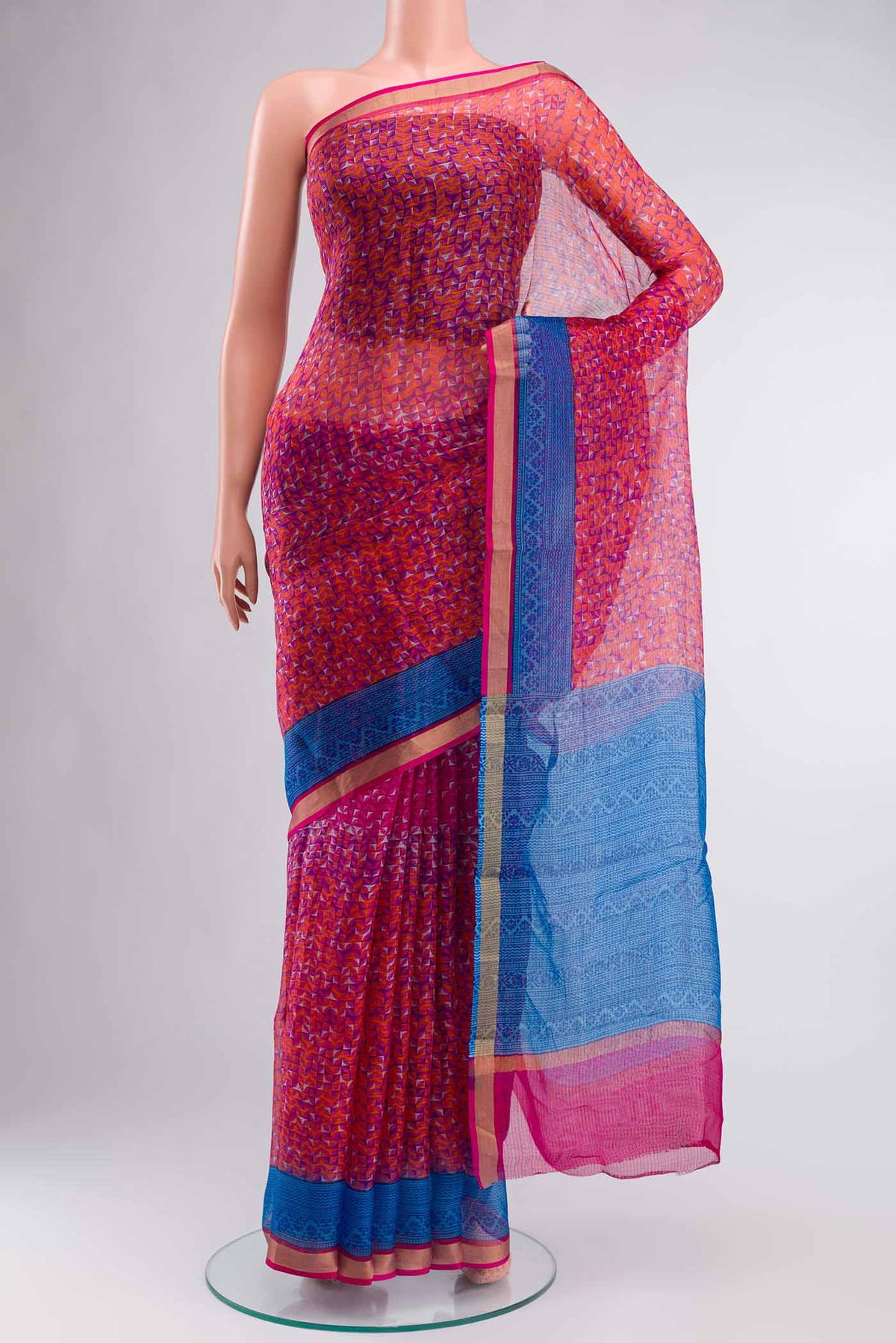Orange Kota Silk SareePrinted design on the body and Zari Border displayed on a mannequin