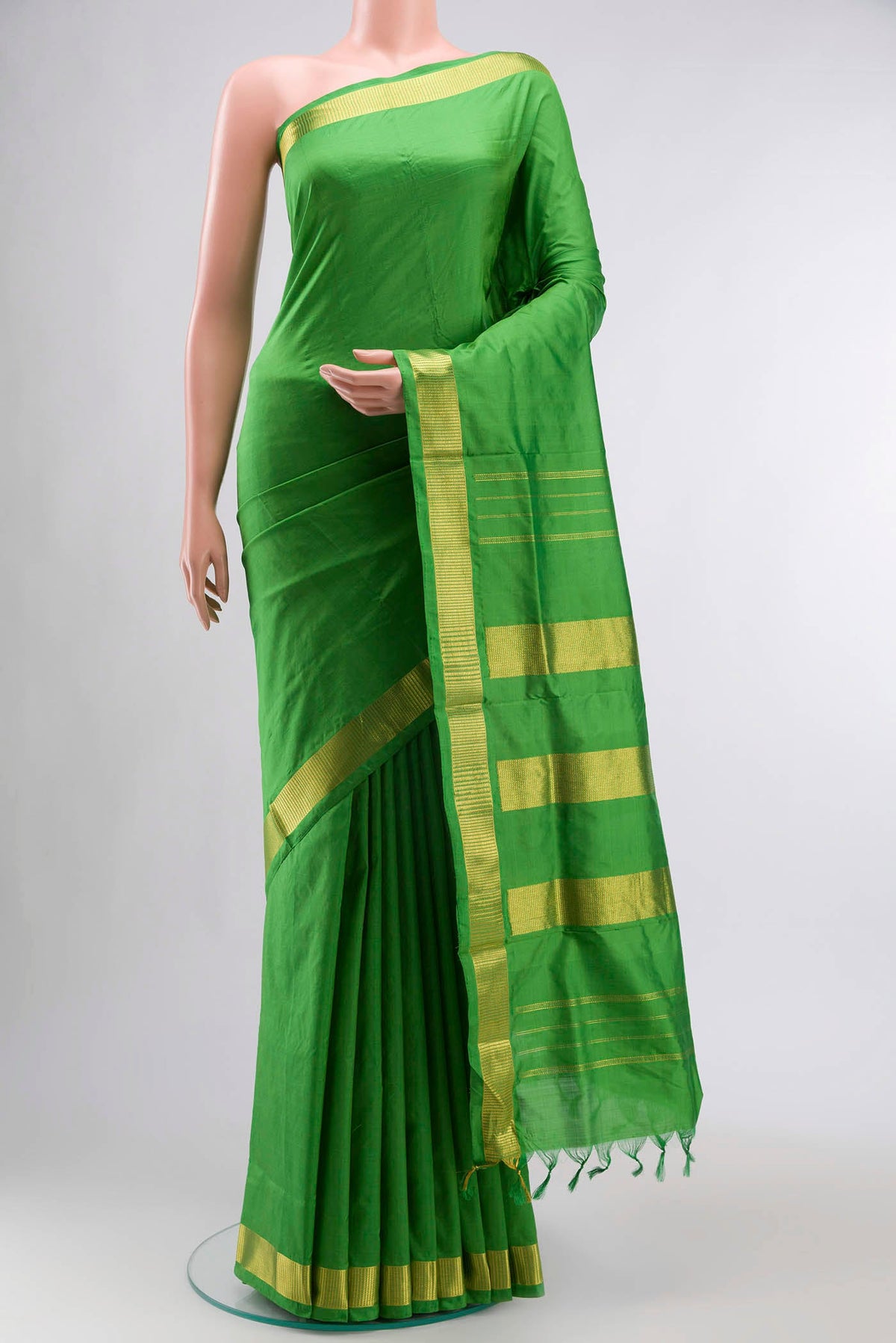 Green Kanchipuram Silk Nine Yards Saree with Plain Body and Zari Border displayed on a mannequin