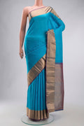 Blue Kanchipuram Silk Saree with Plain Body and Zari Border displayed on a mannequin