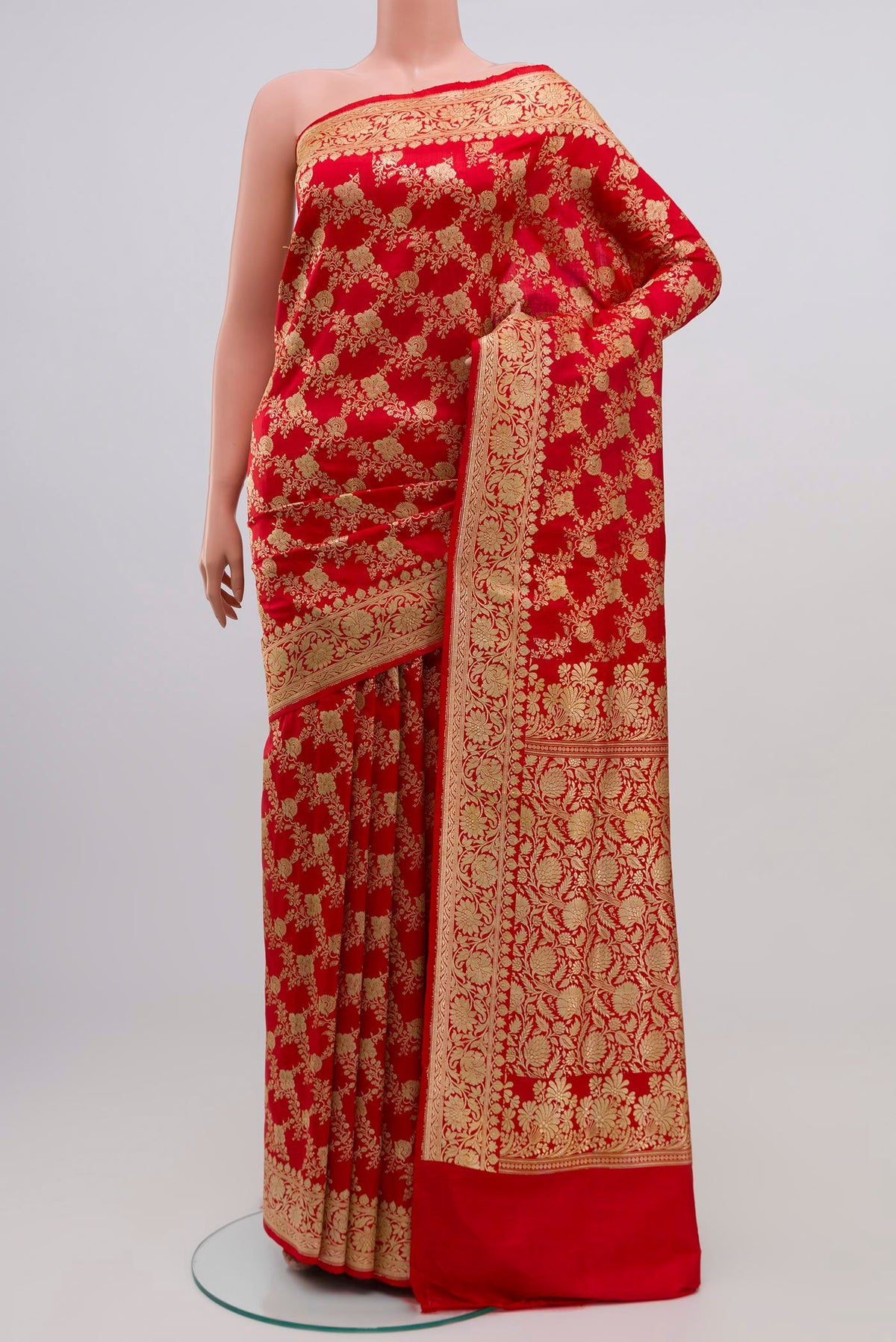 Red Banarasi Saree with Zari Brocade on the body and Zari Border.  displayed on a mannequin