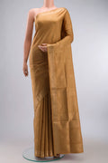 Brown Soft Silk Saree with Zari Butta on the body and Zari Border displayed on a mannequin