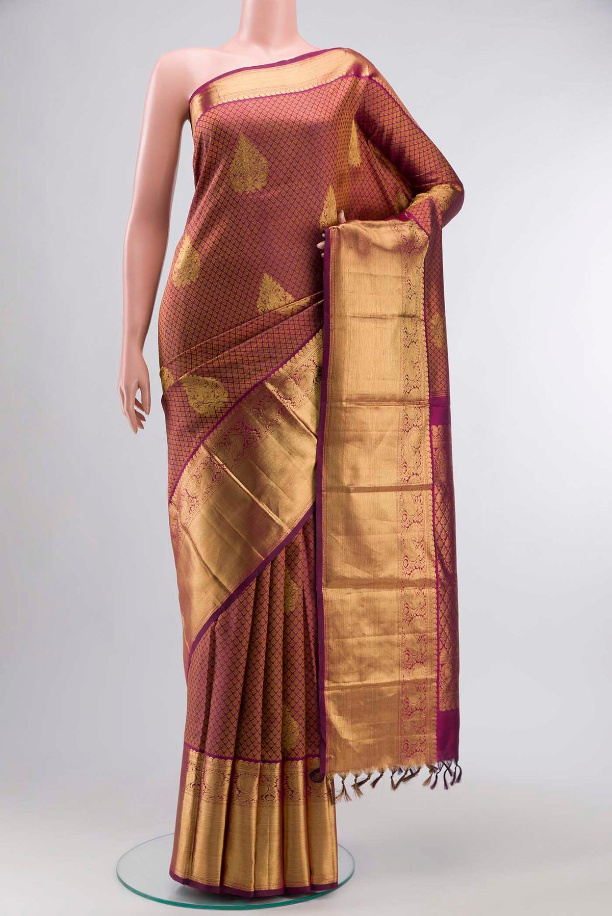 Maroon Kanchipuram Silk Saree with Jacquard With Zari Butta on the body and Zari Border displayed on a mannequin