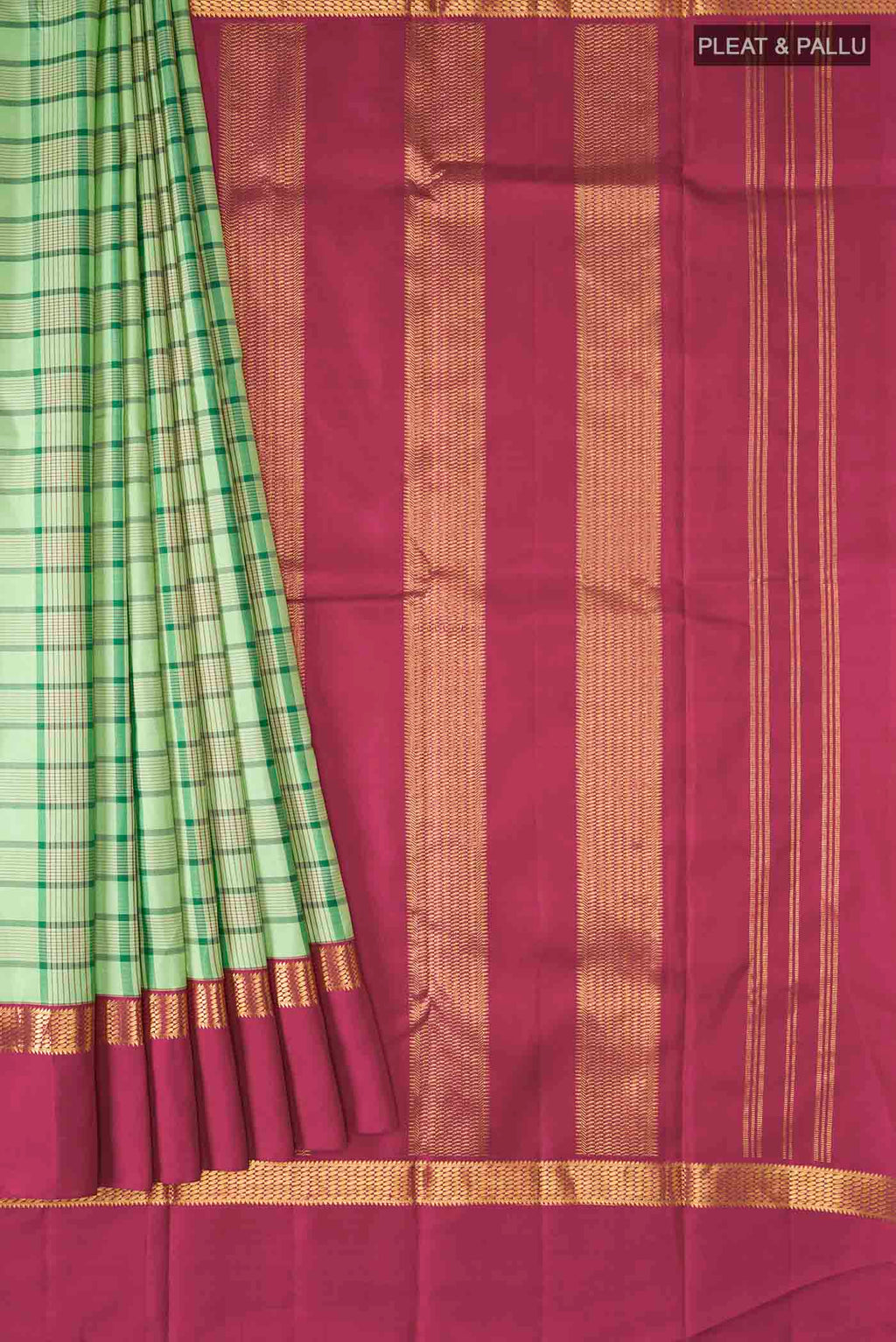 Pleats and pallu of Green Kanchipuram Silk Saree with Checked design on the body and Zari Border