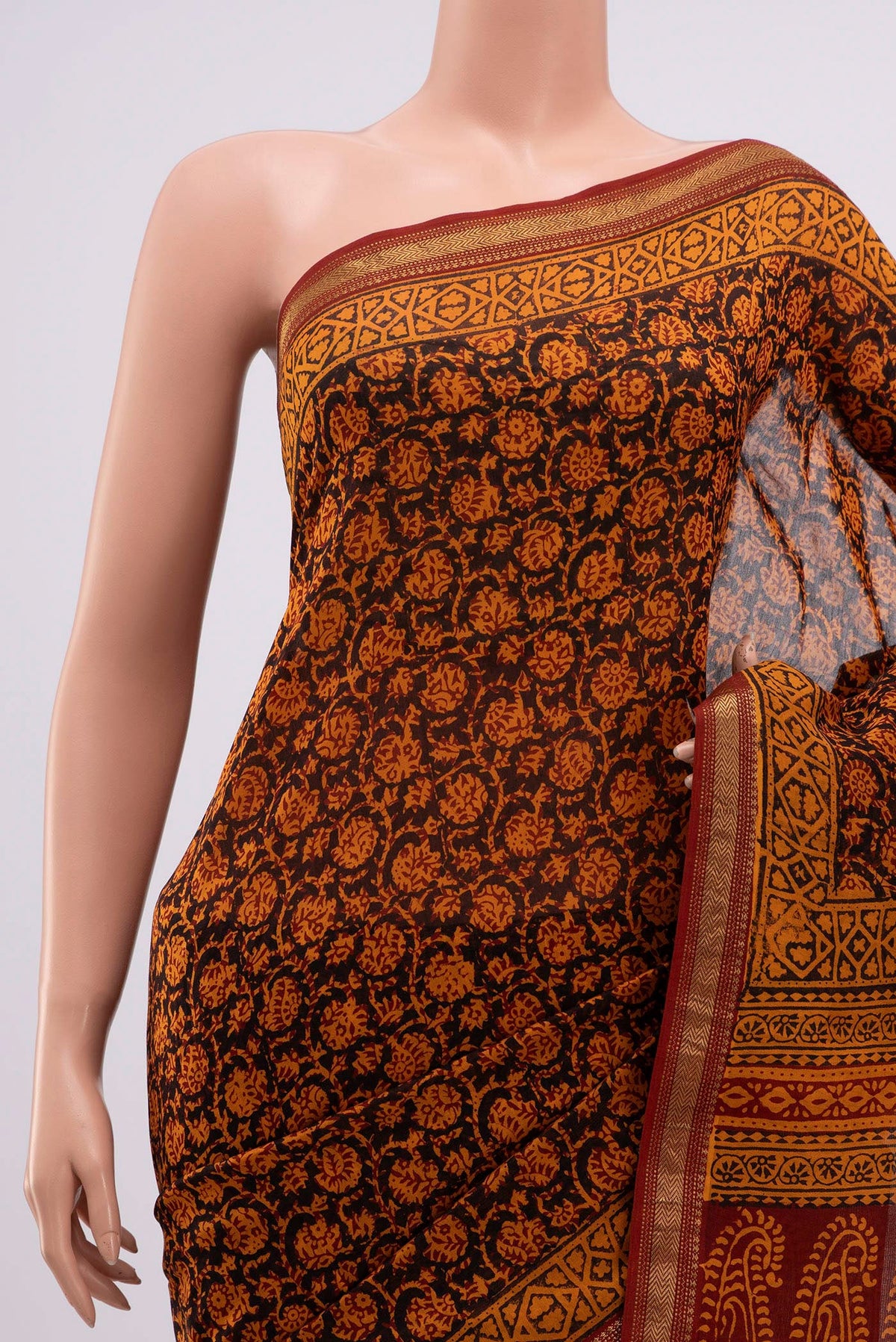 Border image of Brick Orange Maheshwari Silk Cotton Saree with Printed design on the body and Zari Border. 