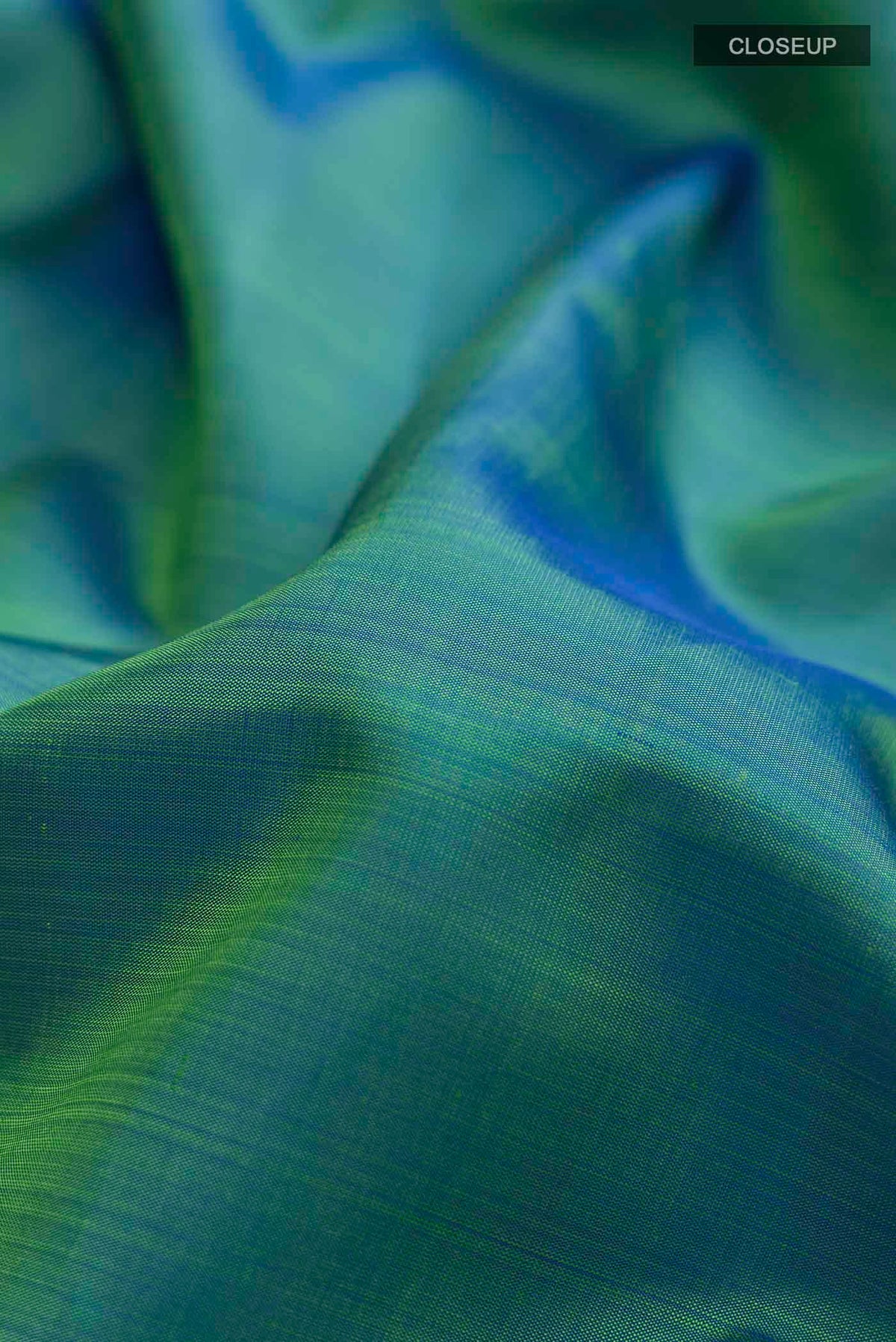 Close up of Blue Kanchipuram Silk Nine Yards Saree with Plain Body and Zari Border displaying folds