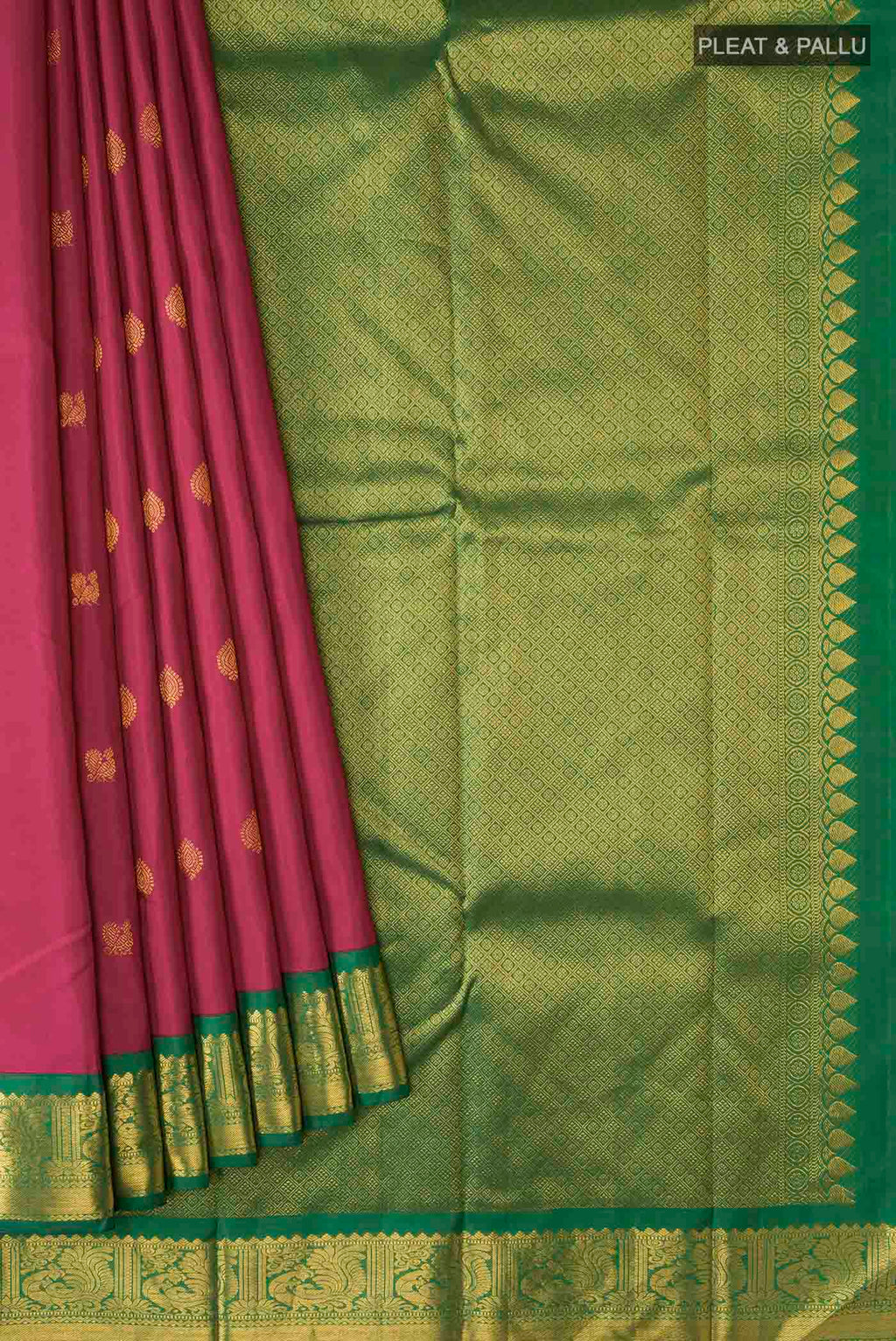 Pleats and pallu of Magenta Kanchipuram Silk Saree with Zari Butta on the body and Zari Border