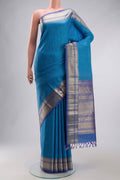Blue Kanchipuram Silk Saree with Thread Butta on the body and Zari Border displayed on a mannequin