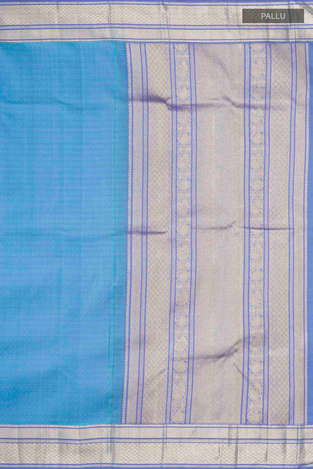 Close up image of the pallu of Blue Kanchipuram Silk Saree with Thread Butta on the body and Zari Border