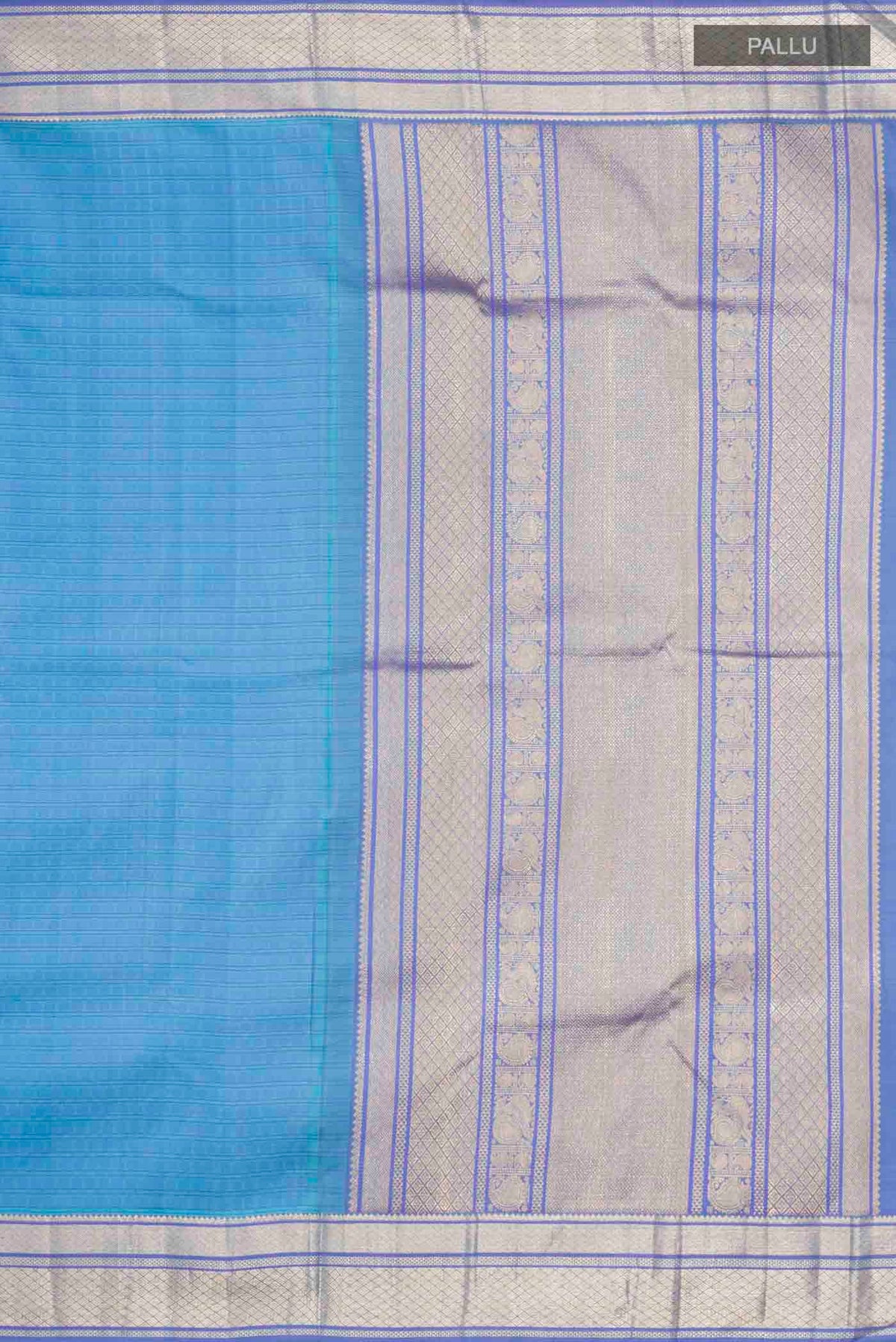 Close up image of the pallu of Blue Kanchipuram Silk Saree with Thread Butta on the body and Zari Border