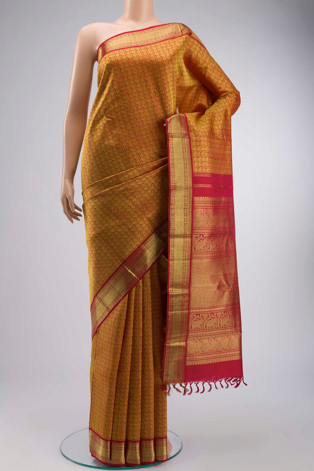 Maroon Kanchipuram Silk Saree with Jacquard design on the body and Zari Border displayed on a mannequin