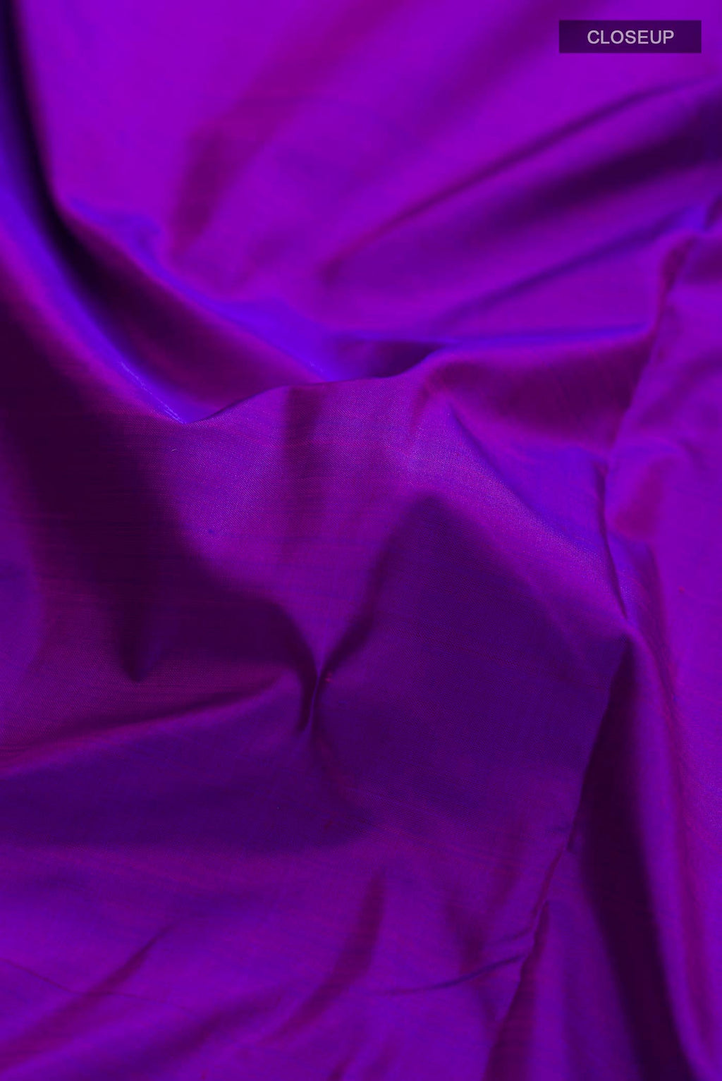 Close up of Purple Kanchipuram Silk Nine Yards Saree with Plain Body and Zari Border displaying folds