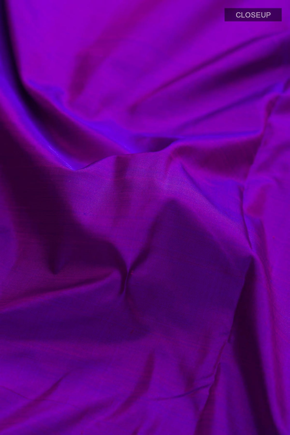 Close up of Purple Kanchipuram Silk Nine Yards Saree with Plain Body and Zari Border displaying folds