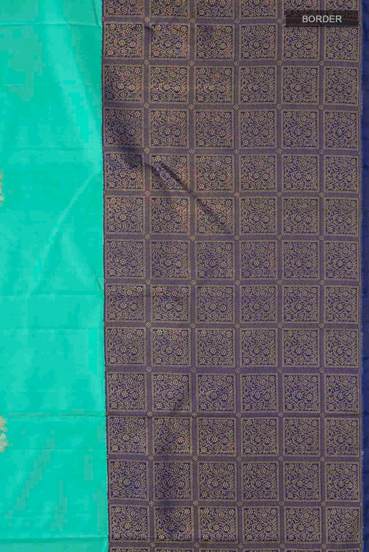 Border image of Green Kanchipuram Silk Saree with Zari Butta on the body and Zari Border