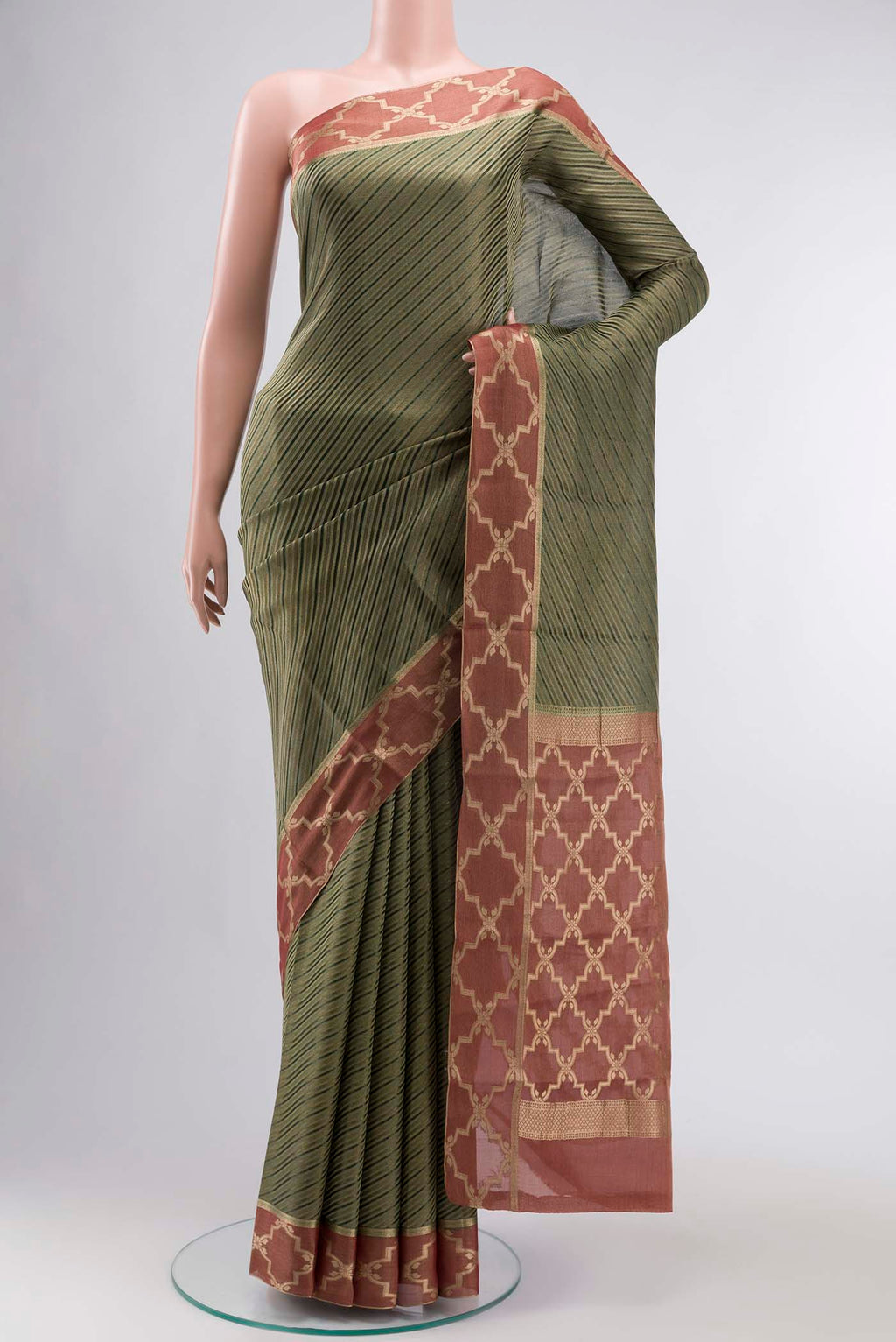 Bottle Green Mysore Georgette Saree with Stripes on the body and Zari Border displayed on a mannequin
