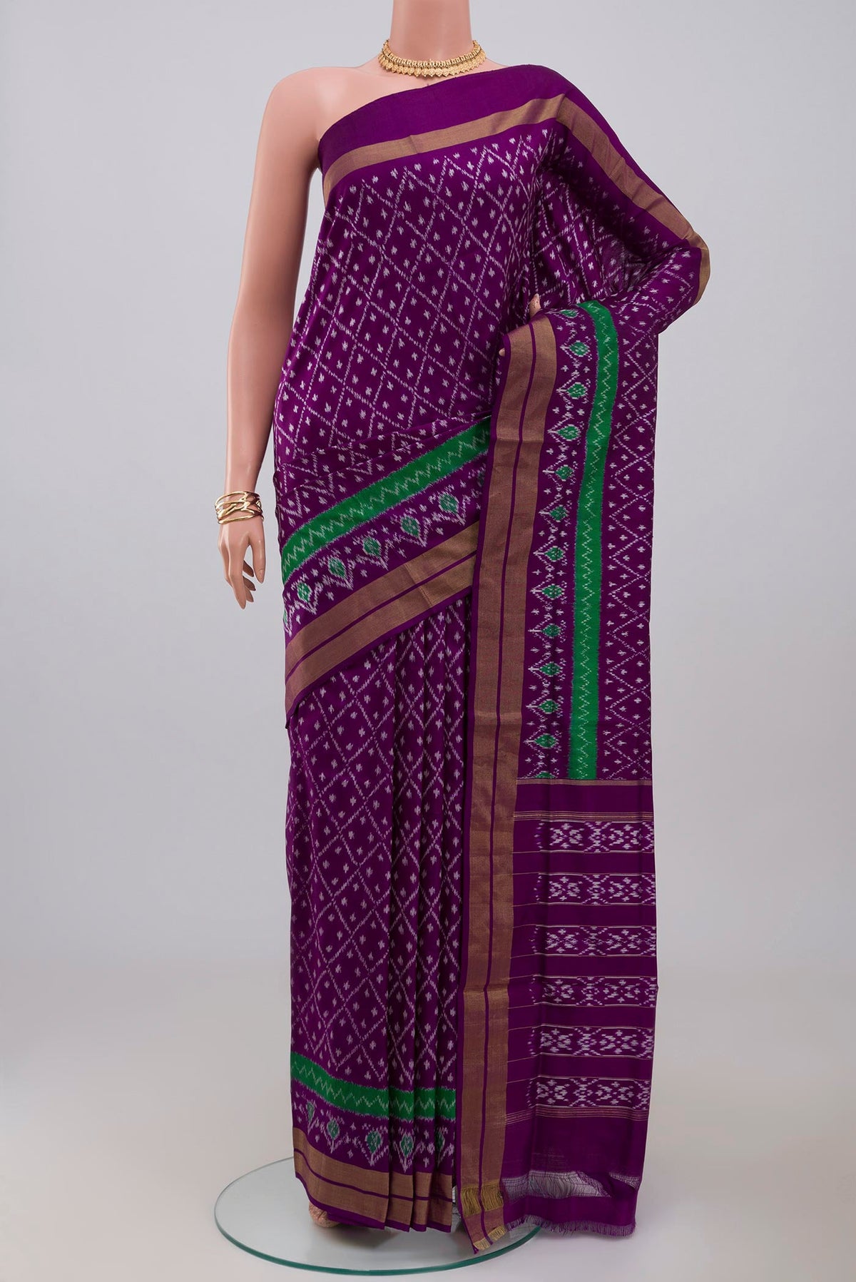 Purple Pochampally Silk Saree with Ikat design on the body and Zari Border.  displayed on a mannequin