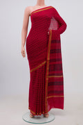 Red Maheshwari Silk Cotton Saree with Printed design on the body and Zari Border.  displayed on a mannequin