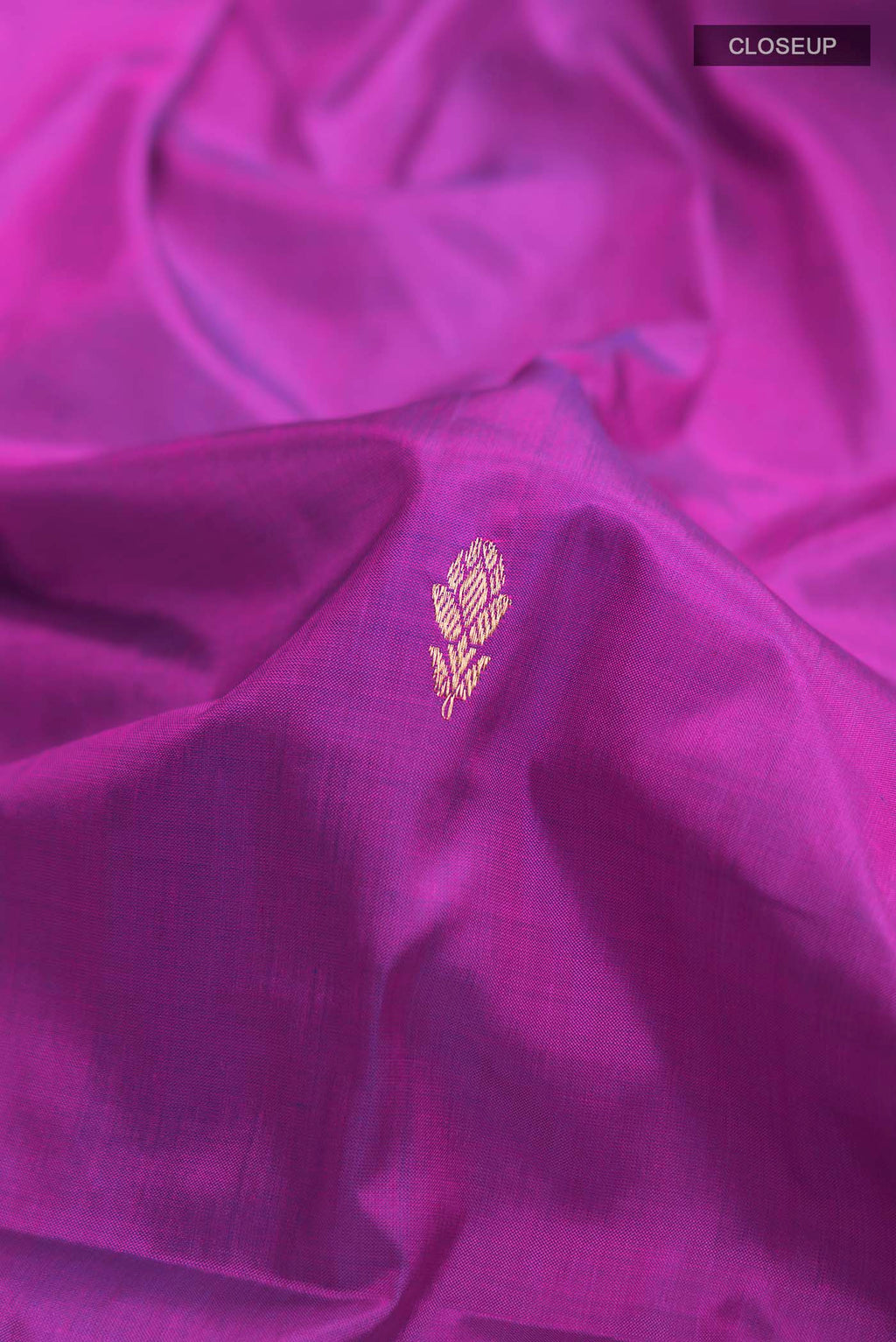 Close up of Purple Banarasi Katan Silk Saree with Zari Butta on the body and Zari Border displaying folds