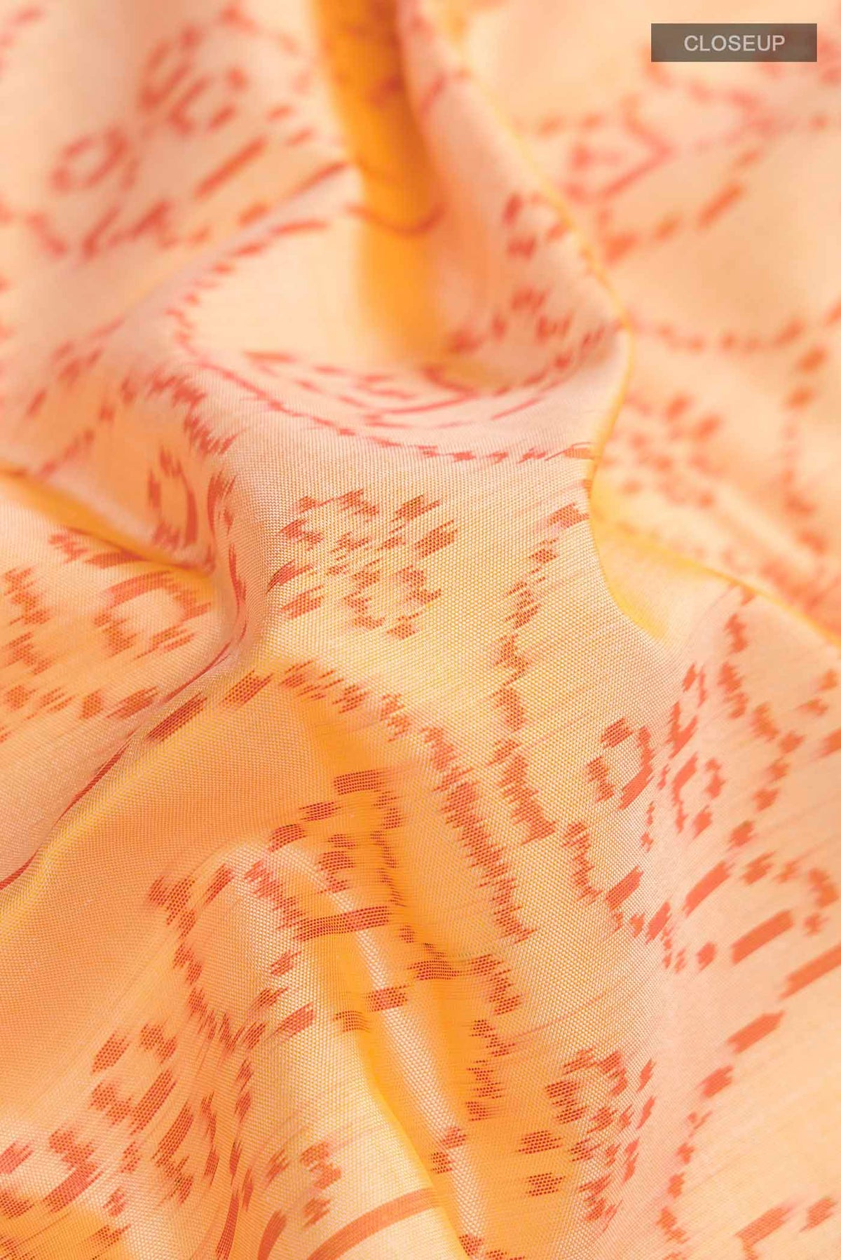 Close up of Red Rajkot Patola Silk Saree with Pure Ikat on the body and Zari Border displaying folds