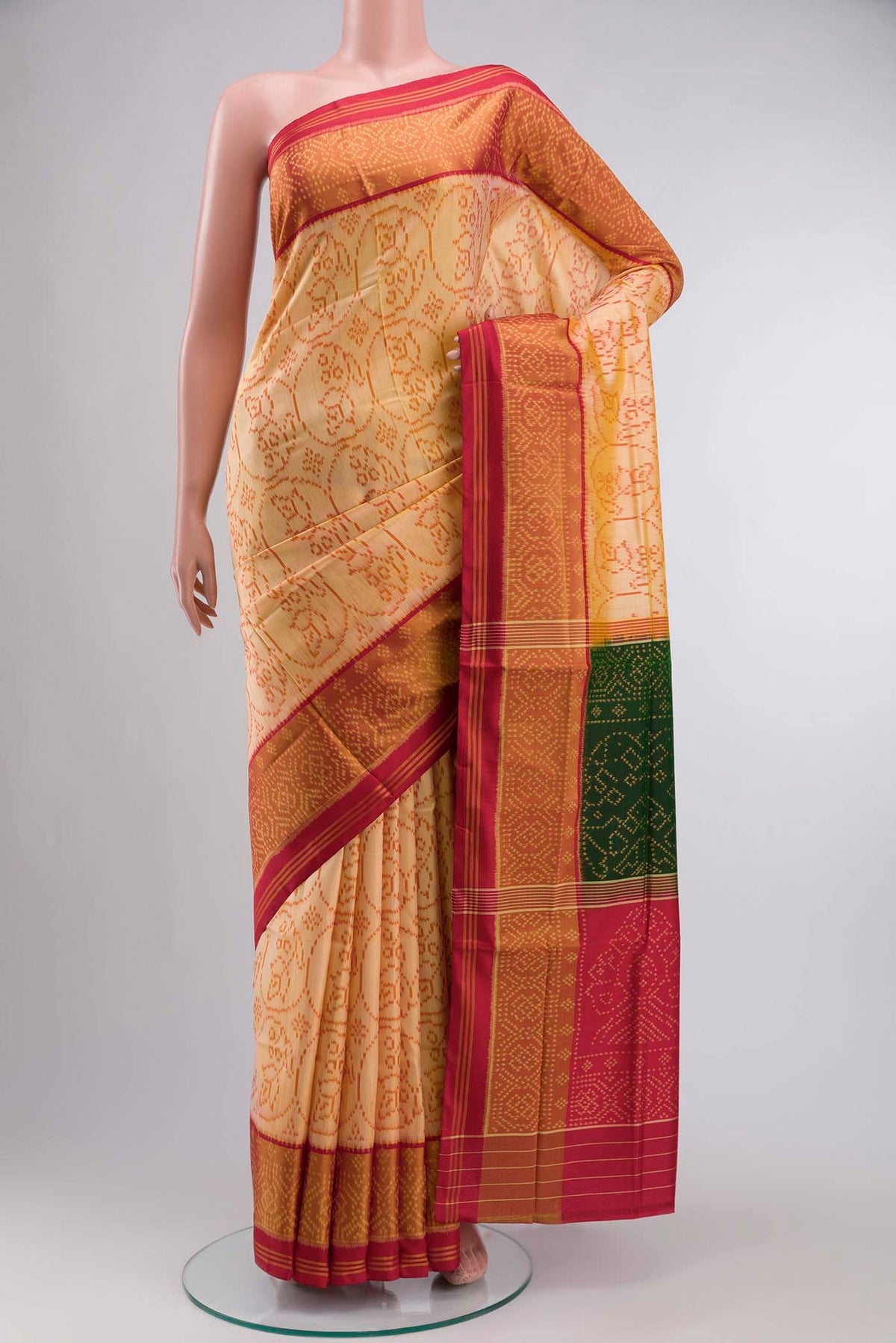 Red Rajkot Patola Silk Saree with Pure Ikat on the body and Zari Border displayed on a mannequin