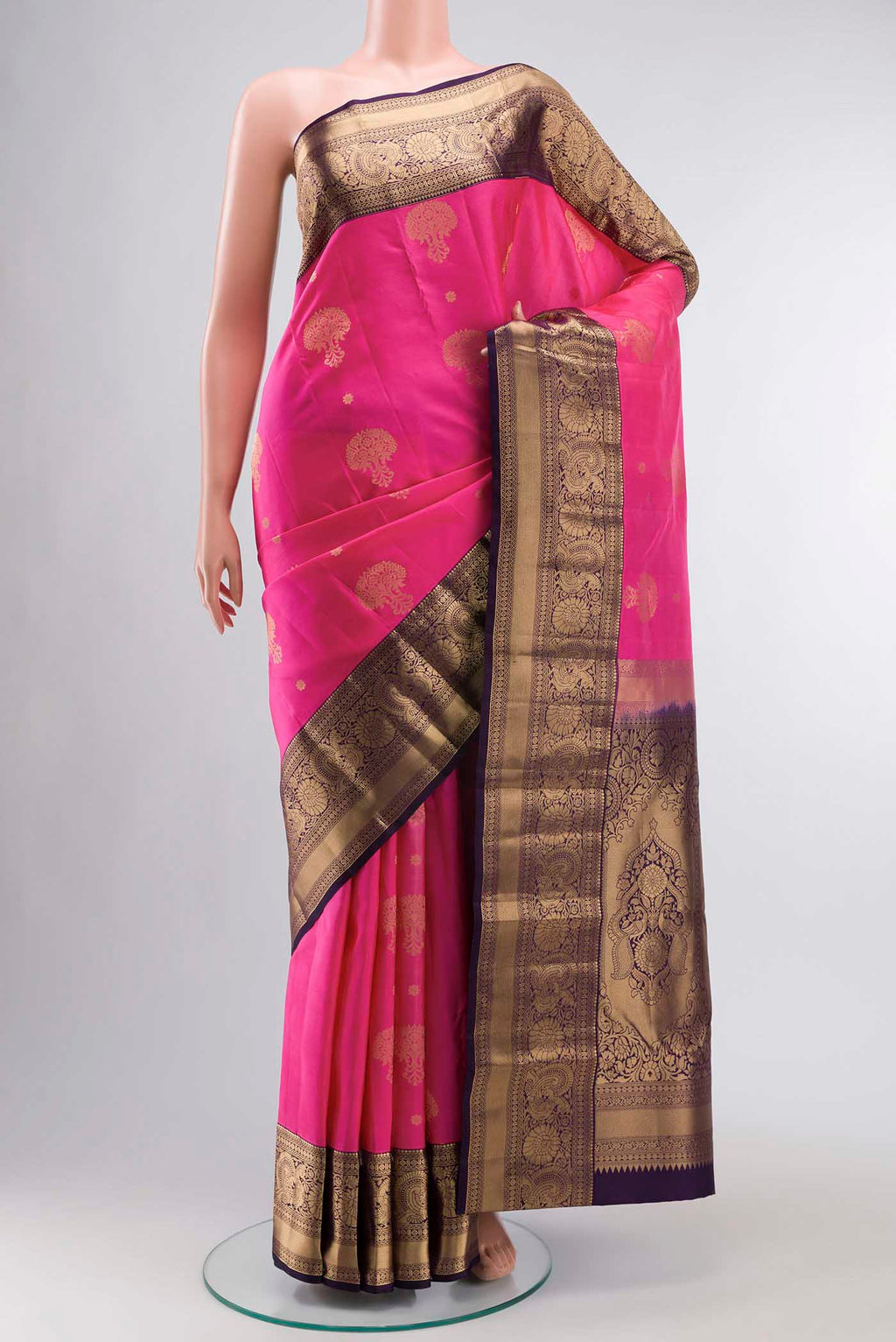 Pink Kanchipuram Silk Saree with Zari Butta on the body and Zari Border displayed on a mannequin