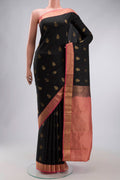 Black Kanchipuram Silk Saree with Zari Butta on the body and Zari Border displayed on a mannequin
