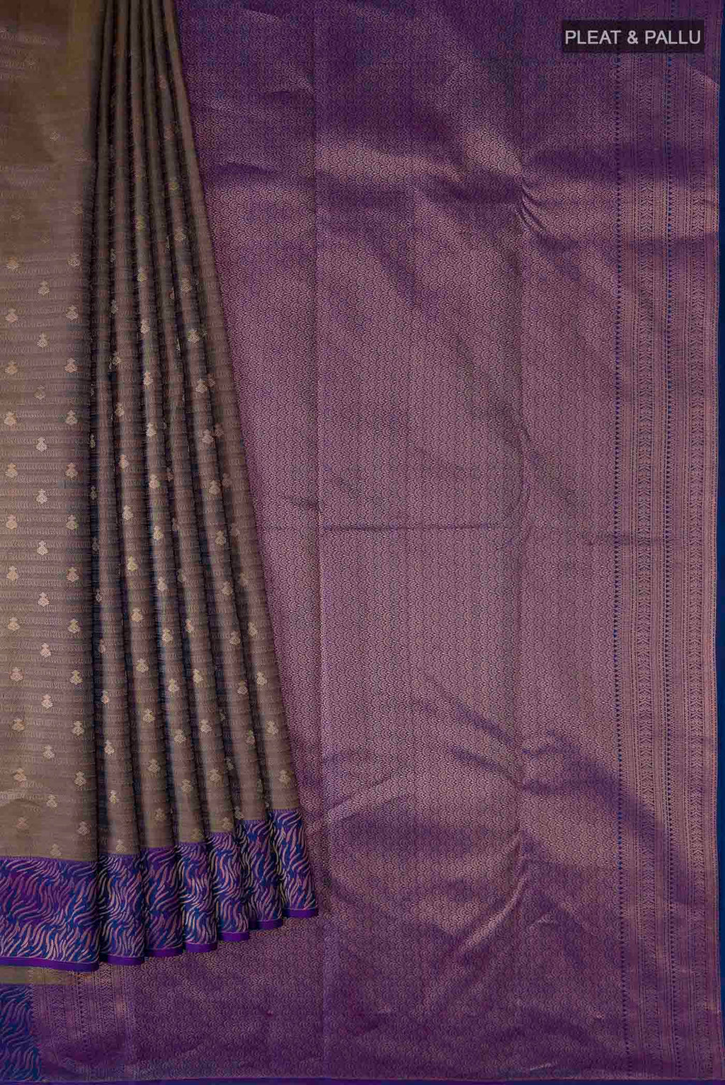 Pleats and pallu of Grey Kanchipuram Silk Saree with Zari Butta on the body and Zari Border