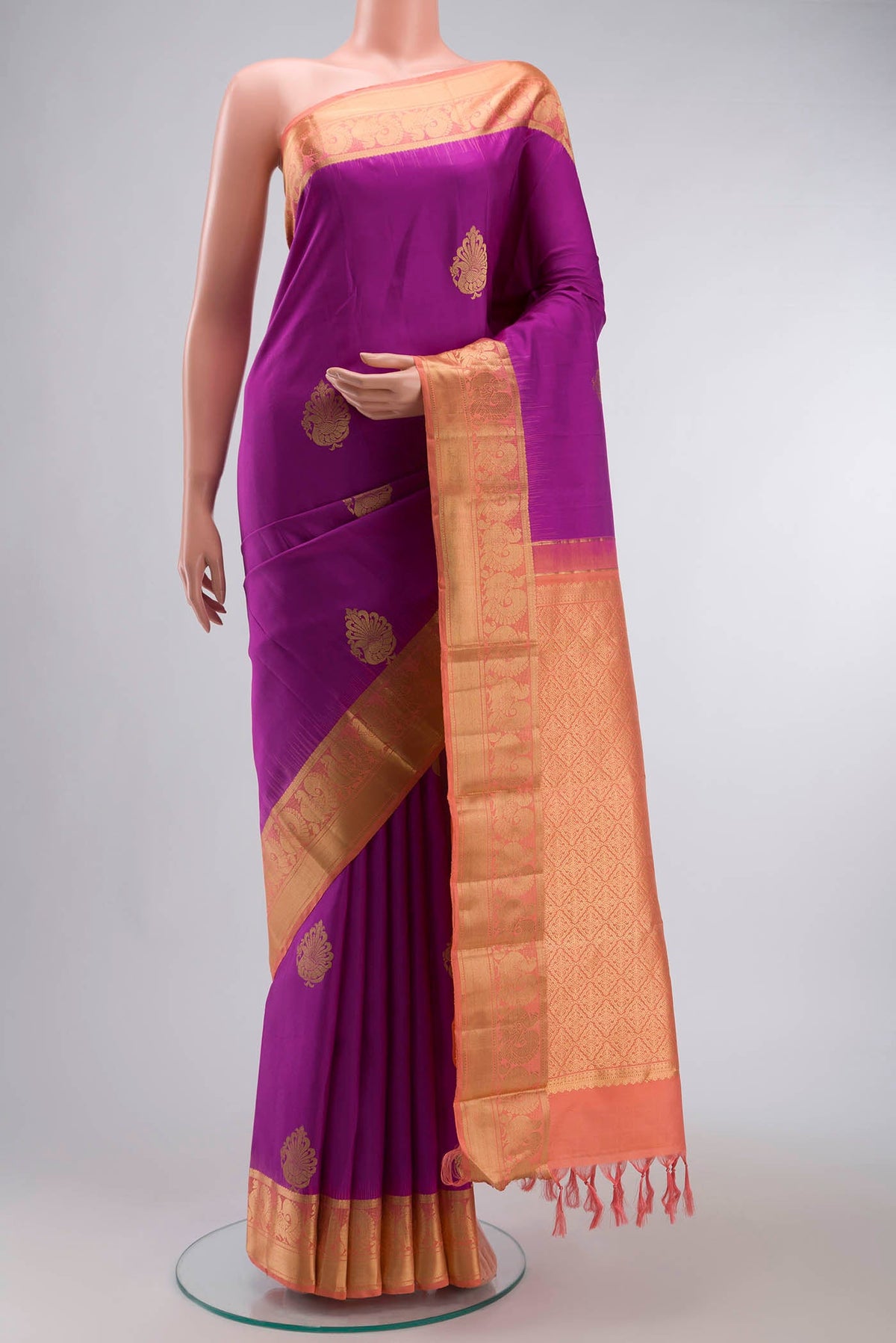 Purple Kanchipuram Silk Saree with Zari Butta on the body and Zari Border displayed on a mannequin