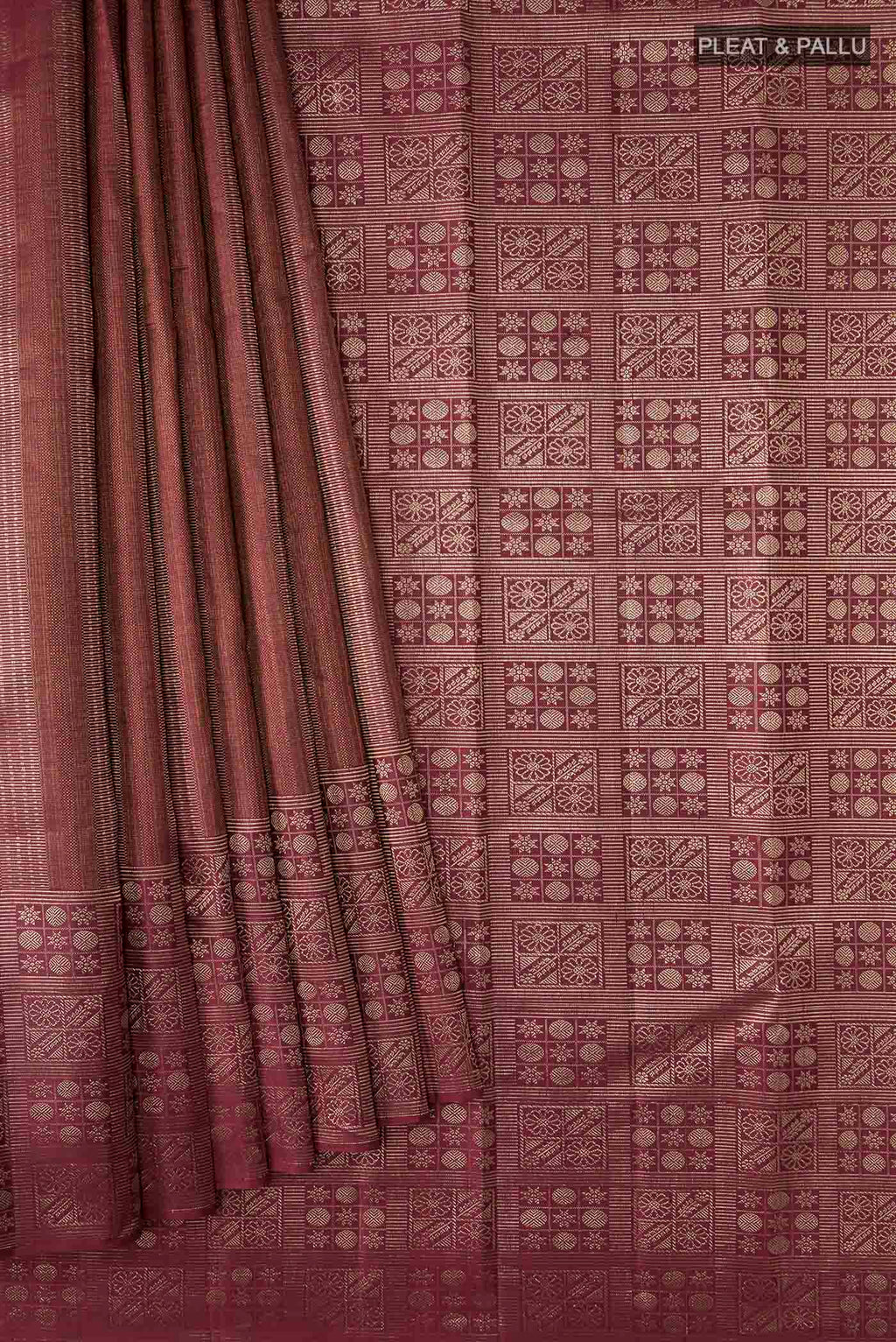 Pleats and pallu of Maroon Kanchipuram Silk Saree with Zari Brocade on the body and Zari Border
