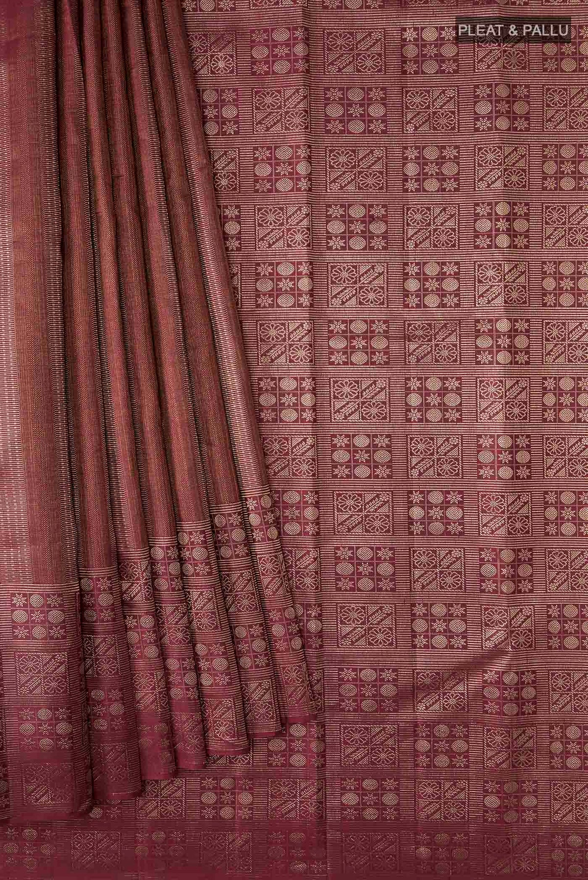 Pleats and pallu of Maroon Kanchipuram Silk Saree with Zari Brocade on the body and Zari Border