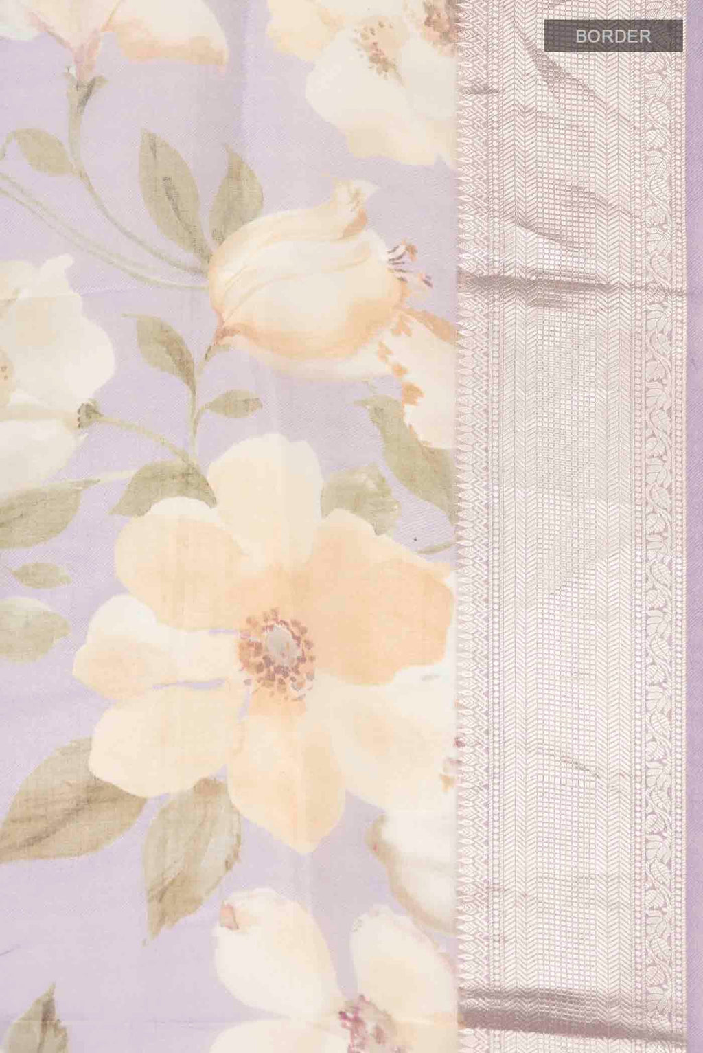 Border image of Lavender Organza Silk Saree with Printed design on the body and Zari Border