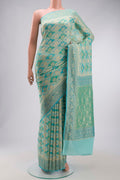 Light Blue Banarasi Georgette Saree with Zari Butta on the body and Zari Border displayed on a mannequin