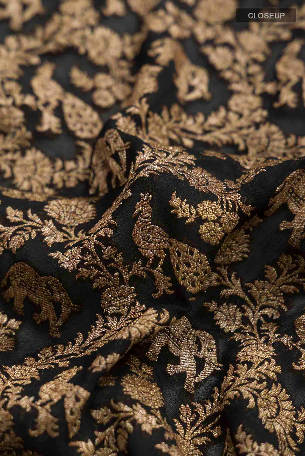 Close up of Black Banarasi Georgette Saree with Zari Brocade on the body and Zari Border displaying folds