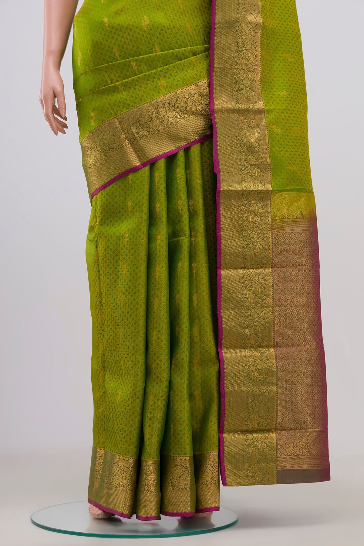 Pleats and pallu of Green Kanchipuram Saree with Jacquard With Zari Butta on the body and Zari Border. 