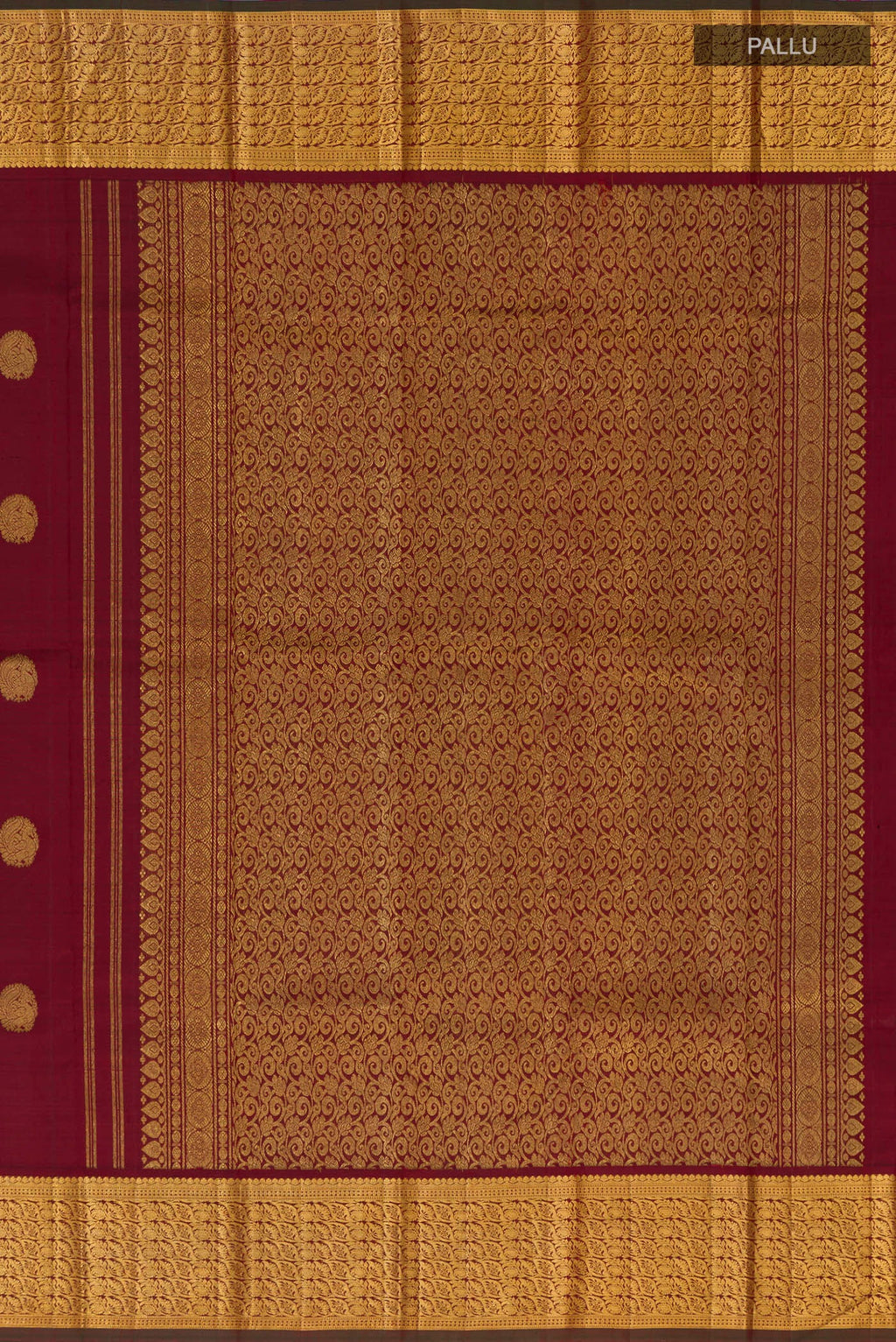 Close up image of the pallu of Pure Silk Pure Zari Maroon Kanchipuram Saree with Zari Butta on the body and Zari Border. 