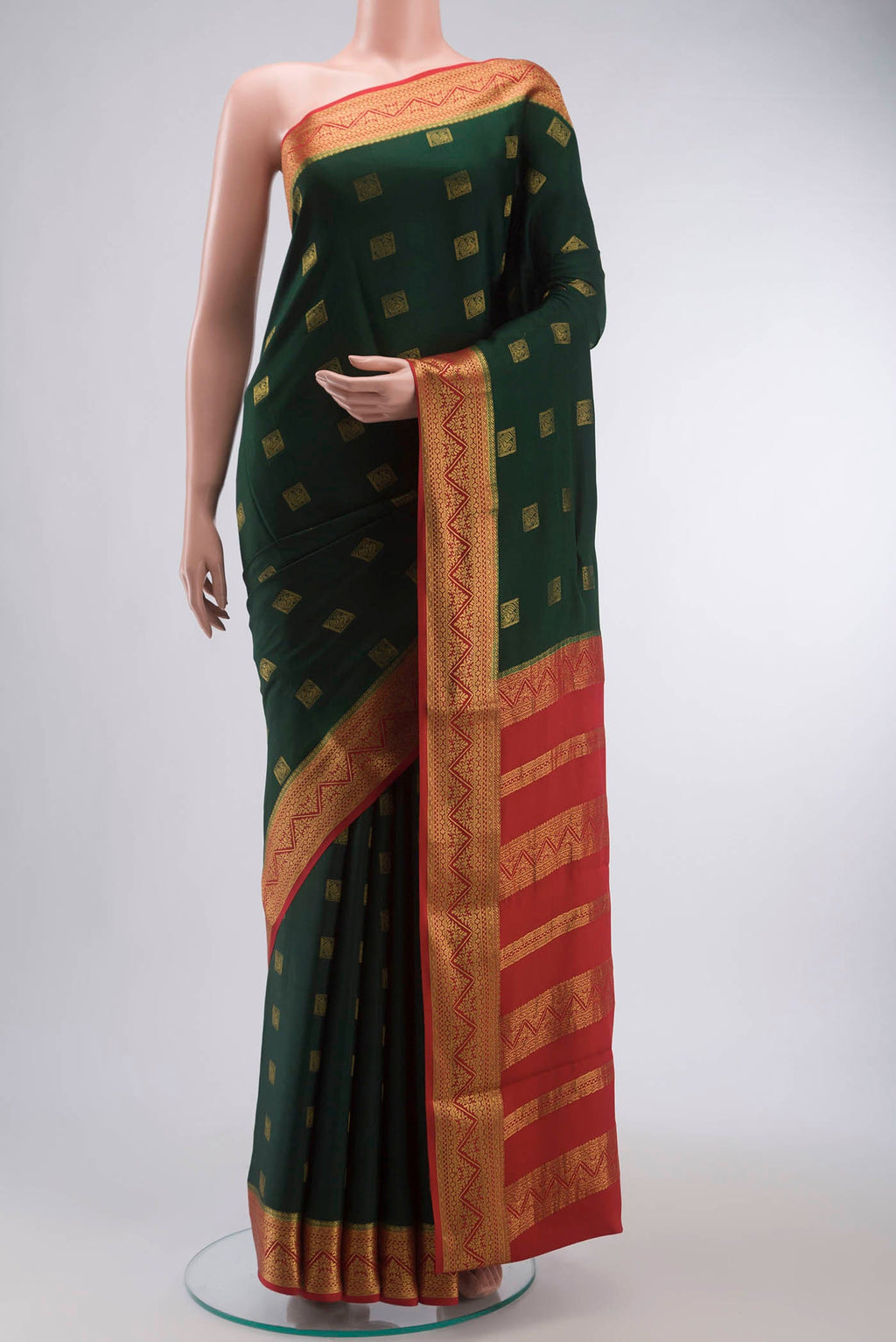 Green Mysore Crepe Saree with Zari Butta on the body and Zari Border displayed on a mannequin