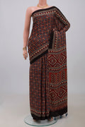 Maroon Blended Satin Silk Saree with Ajrakh Print on the body and Printed Border.  displayed on a mannequin