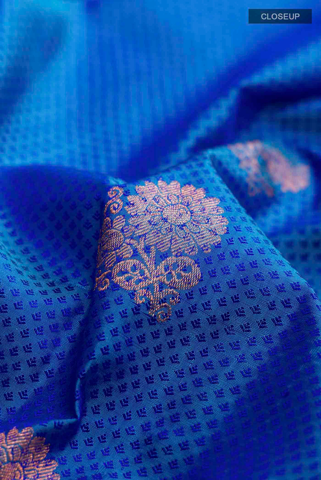 Close up of Blue Kanchipuram Silk Saree with Jacquard With Zari Butta on the body and Zari Border displaying folds