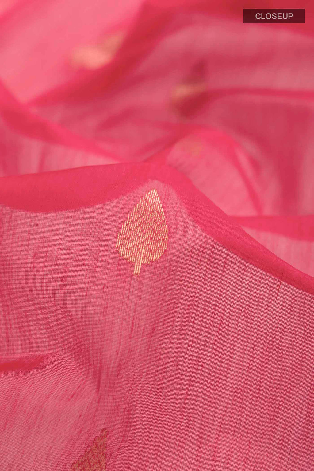 Close up of Red Chanderi Silk Saree with Zari Butta on the body and Zari Border displaying folds