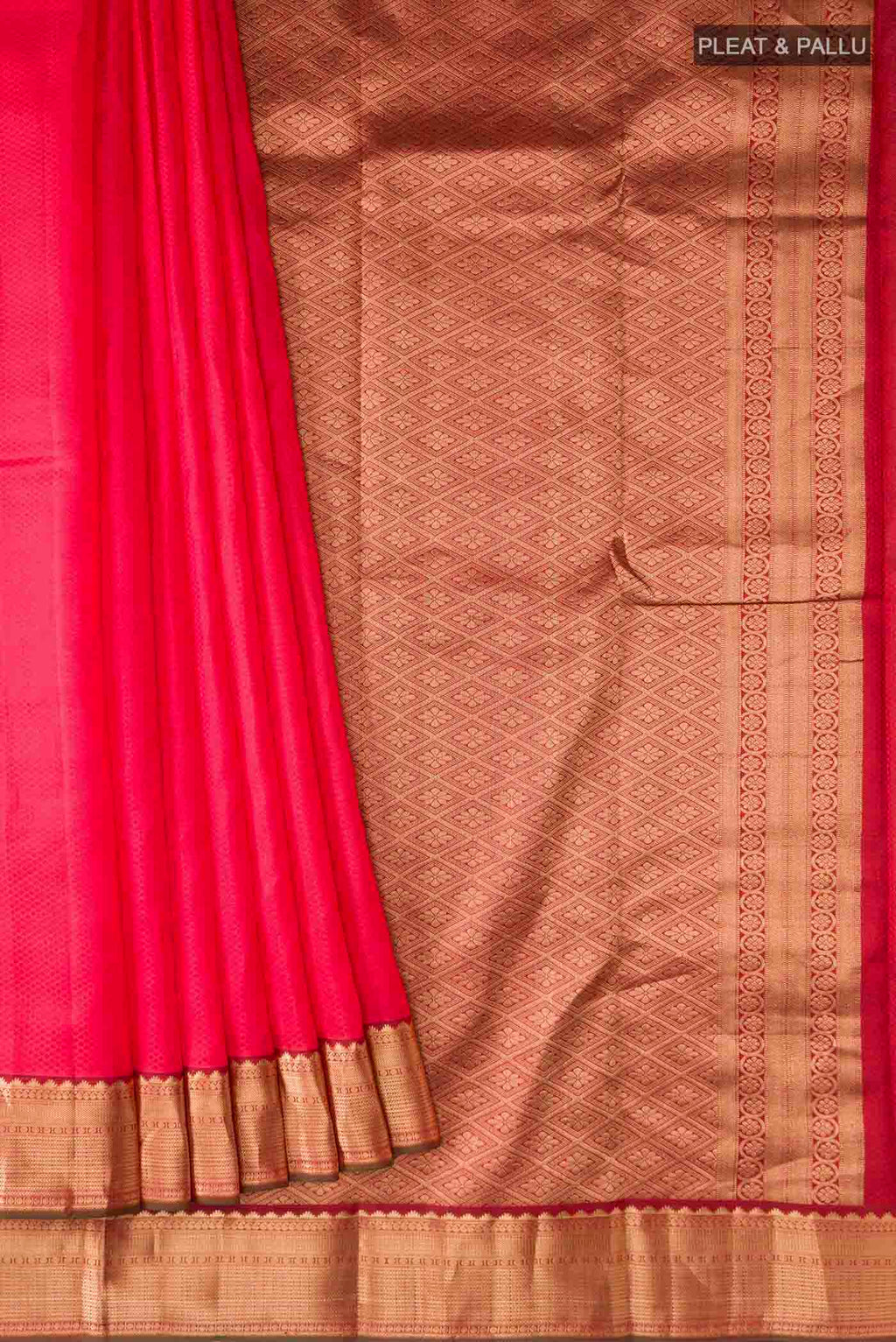 Pleats and pallu of Red Kanchipuram Silk Saree with Jacquard design on the body and Zari Border