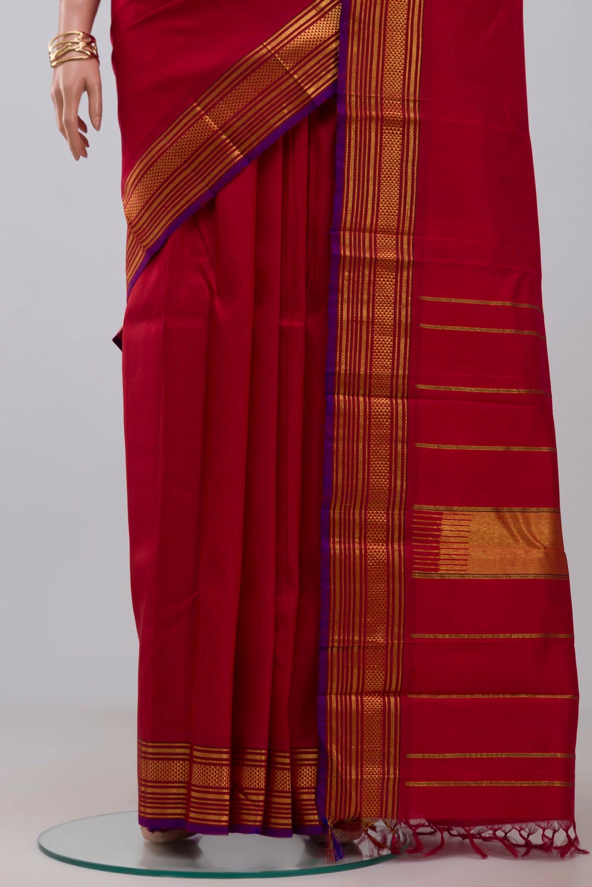 Pleats and pallu of Pure Silk Pure Zari Red Kanjivaram Saree with Plain Body and Zari Border. 