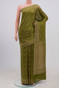 Green Mysore Crepe Saree with Zari Brocade on the body and Fancy Border.  displayed on a mannequin